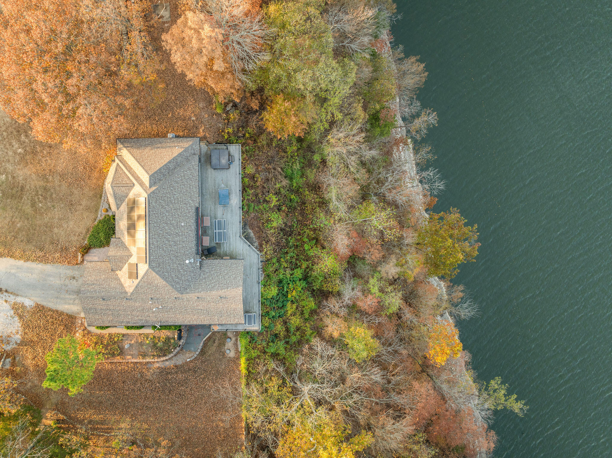 This LAKEFRONT, BLUFFTOP, gated 2-acre estate has the gorgeous view of Table Rock Lake you've been waiting for combined with the privacy you've only dreamed of, and a luxuriously huge flat yardspace you have to see to believe. It also boasts a 3,000+ ft climate-controlled shop building with high rollup doors and more than enough room for all your big toys. Beautiful construction, quality materials and the perfect location make this home a unique and rare combination!