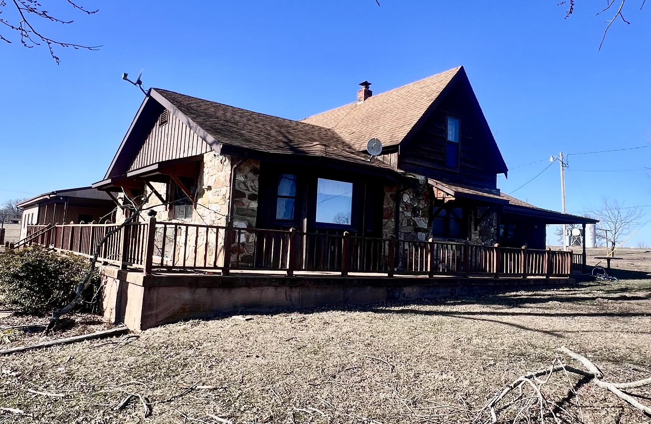 A rare opportunity to own a vast and stunning piece of farmland. This beautiful property encompasses approximately 362 acres, featuring a 12-acre lake with a building site, 7 ponds, 9 cattle waterers, and 2 wells. The property includes a 3-bedroom, 2-bath house with a huge sunroom and an 18 x 36' heated inground pool with electric pool cover, diving board, slide and built in hot tub. A pool house with 960 square feet of living space with a kitchen, full bath and an indoor sauna with a 3-bay carport. Multiple outbuildings are present, including a 140' x 60' equipment barn with a 30' x 30' heated shop area, a 150' X 32' USDA Feeder Barn, a commodity barn, a hay barn, storage sheds, shop and working weigh scales. This is what farmers dream of.
