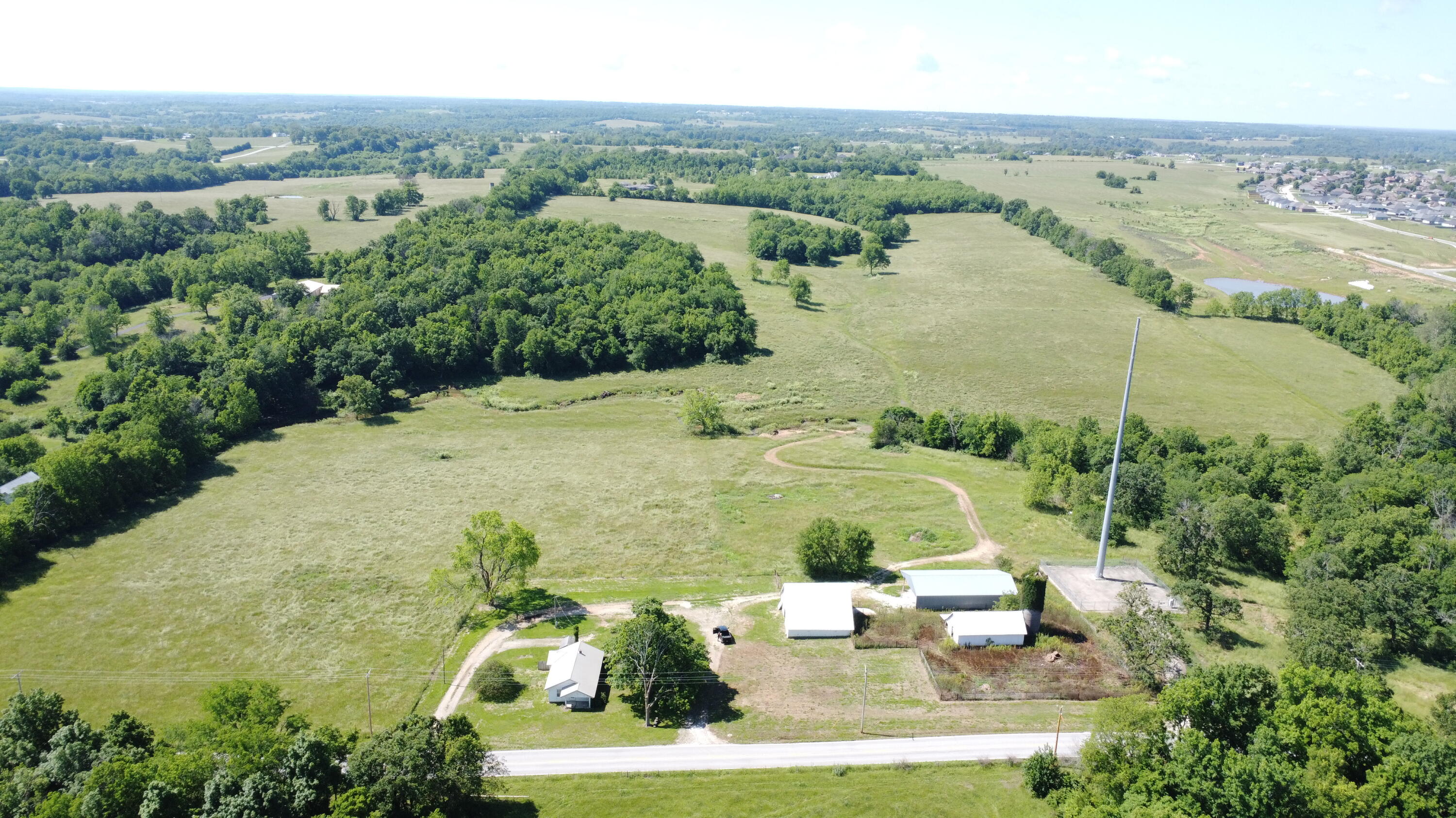 Incredible development opportunity in one of Southwest Missouri's fastest-growing markets! This 160+/- acre tract is ideally located on Farm Road 186 in Republic, Missouri, just down the road from the highly popular Republic Water Park and adjacent to the final phase of Shuyler Ridge -- one of Republic's most successful residential developments.A conceptual site plan indicates the potential for 450-500 residential lots on this property, offering a perfect canvas for large-scale subdivision development. Recent lot sales in Republic are consistently closing above $80,000 per lot, demonstrating strong buyer demand and robust market activity.Republic has experienced a surge in growth over the past decade, with the population now surpassing 20,000 residents and steadily climbing. The city continues to attract both residents and businesses, fueled by significant investments in public amenities like the expanded Republic Aquatic Center and the new 136-acre regional sports complex at J.R. Martin Park. Major companies such as Convoy of Hope and Amazon have also established large operations nearby, further driving economic growth and creating new housing demand.Located just minutes from Highway 60, this site offers easy access to Springfield and other surrounding communities while enjoying the benefits of a thriving local market. The property sits near schools, parks, and retail centers, making it ideal for residential development that caters to families and professionals alike.Don't miss this rare chance to secure a large-scale development site in a market where demand shows no signs of slowing. With ideal proximity to key amenities, strong comps, and an active, growing population, this 160+/- acre parcel is poised to deliver outstanding potential returns.