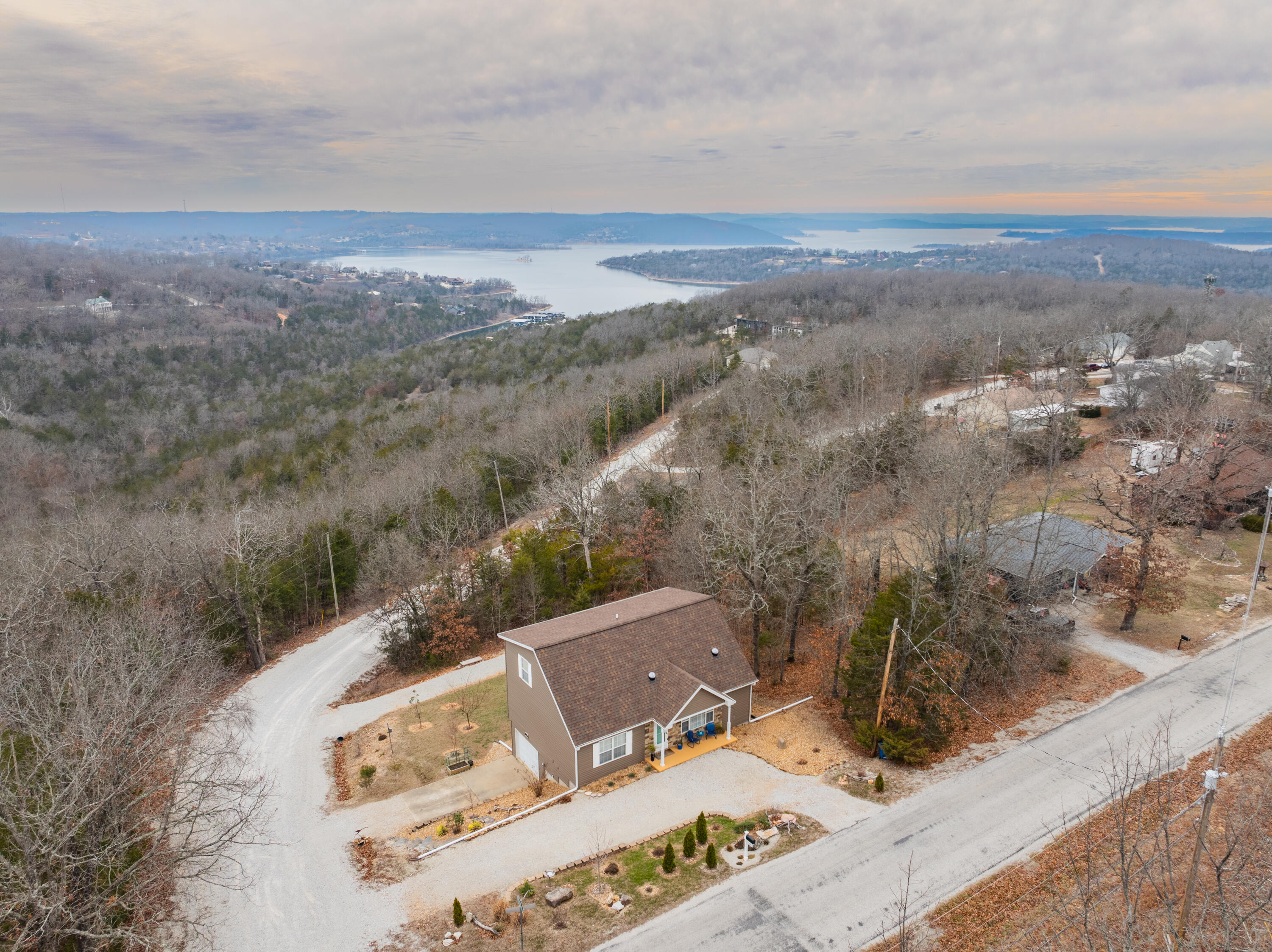 Experience breathtaking views of Table Rock Lake in this stunning Oakmont community home!This beautifully updated property features a brand-new roof, siding, gutters, and downspouts, with an HVAC system that's only a year old. With three spacious ensuites, a cozy fireplace, and an RV/boat parking pad, this home is as functional as it is inviting.Enjoy the incredible Oakmont amenities, including an indoor pool, private dock, RV park for members, storm shelter, community center, and exercise room. Every inch of this home is thoughtfully designed and impeccably maintained. Schedule your tour today and make this lake-view retreat your own!