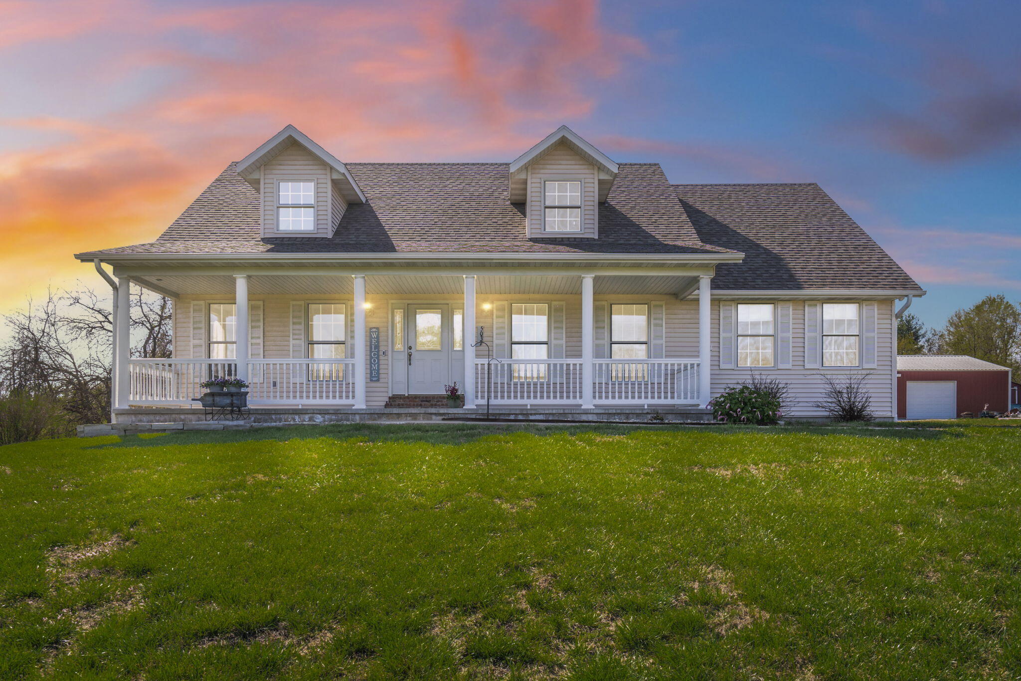 Welcome to this beautiful country retreat just North of Springfield. Custom built in 2002 by Jeff Kramer, this unique multi-level home is perfectly situated on 17.93 acres of scenic pastureland, offering peace, privacy, and a daily front-row seat to roaming wildlife like deer and turkeys. The main floor features 3 spacious bedrooms and 2 full bathrooms, an eat-in kitchen, and a vaulted living room ceiling anchored by a stunning stone fireplace. Downstairs, a walkout basement includes a non-conforming 4th bedroom, plumbing for a wet bar, 3rd full bathroom, and ample unfinished storage space. Upstairs, a massive 26x15 bonus room awaits your vision--perfect for a 5th bedroom, craft room, or additional living area. Step outside to a large screened-in porch just off the kitchen, ideal for soaking in the seclusion. For hobbyists or business owners, the 30x50 heated shop with three bays, 220V electricity, and electric openers on each bay is a dream come true. Plus, there's an additional 30x40 pole barn offering even more flexibility and space for tools, toys or equipment. This one-of-a-kind property offers endless possibilities with quick access to town.