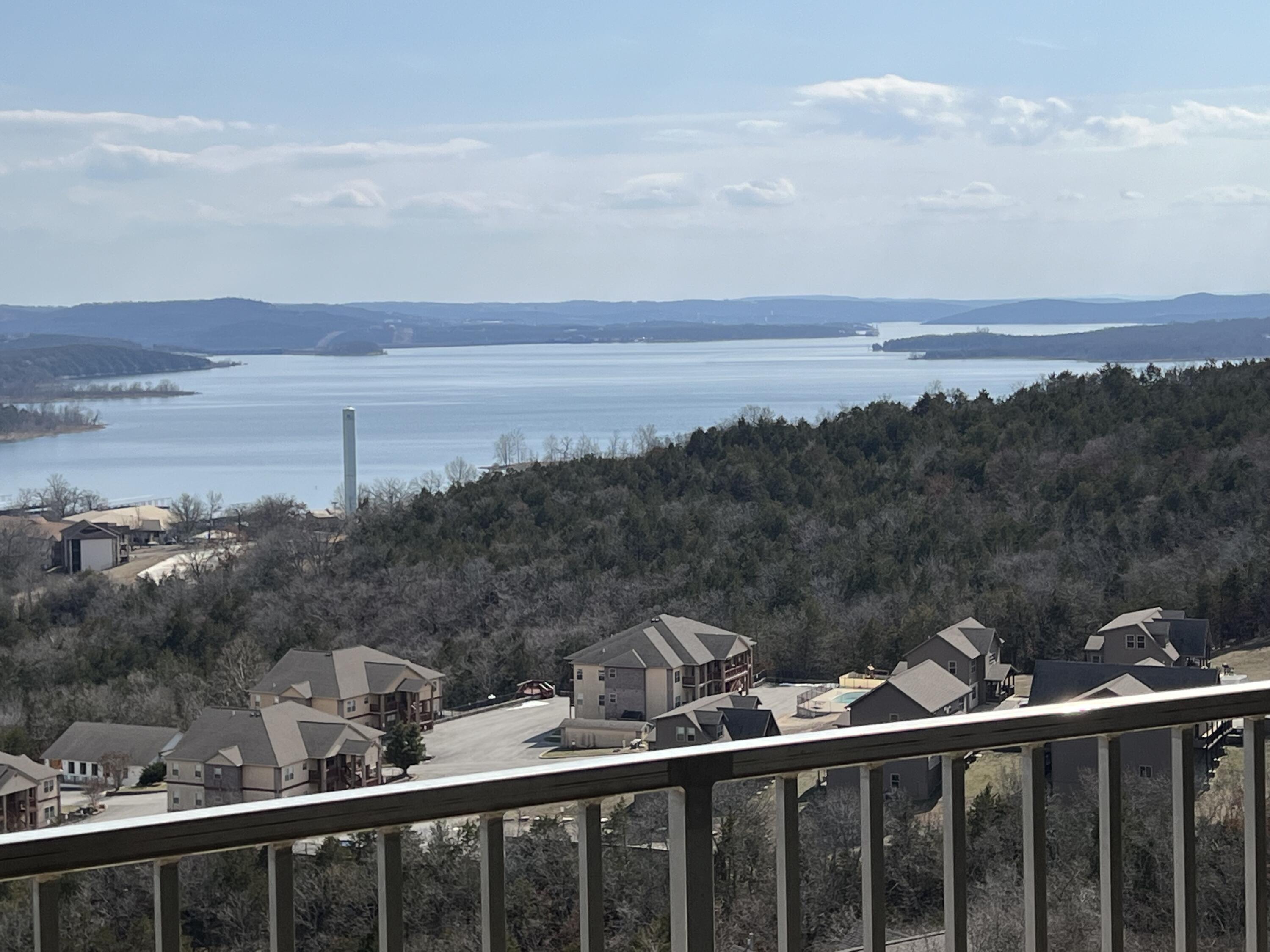 TABLEROCK LAKE VIEW!  You can now own one of the fabulous lake views at Treehouse on the Lake.  Drive into the garage and take the elevator to the 4th floor.  Treehouse on the Lake qualifies for overnight rental, but you will find that the community is mostly permanent residence and/or personal vacation homes.You will enjoy this 3bedroom (3rd bedroom unconventional) 2 full bath luxury condo.Sold fully furnished!*Granite counter throughout*Wood look tiled floors*Geo/water HVAC system (utilities extremely low)*9 foot ceilings*Large Covered balcony*Crown molding*Oversized Custom Windows*Garage space available in enclosed garage (20,000)
