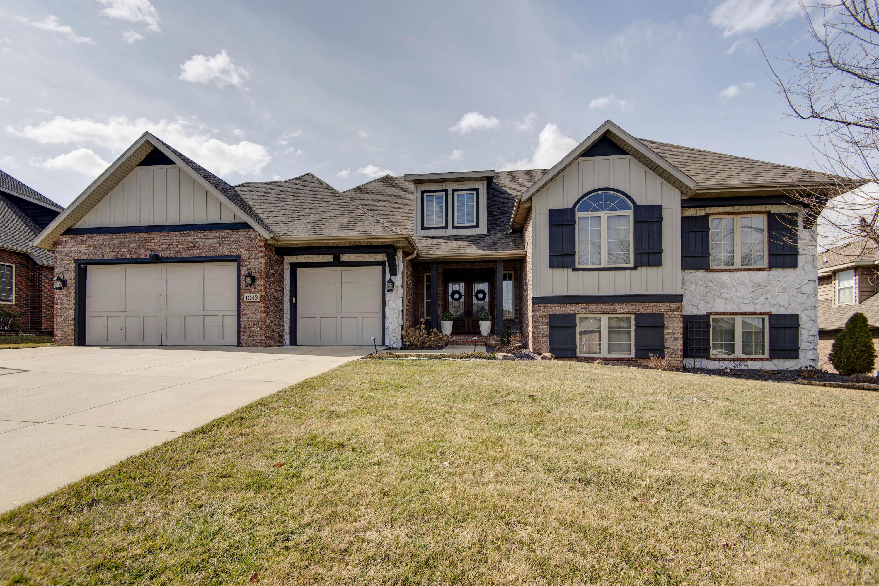 Beautiful all brick, basement home in one of Republic's most sought-after subdivisions. This 5 bedroom, 3.5 bath is ideally situated on a prime lot backing up to a pond. Many recent updates including ROOF in 2019, Basement AC in 2024, 75 gallon hot water heater in 2023, and all new landscape/rock in 2023. Additional features include huge master bedroom w/fireplace and sitting area, 3 fireplaces total,  screened-in back patio, and fenced yard.
