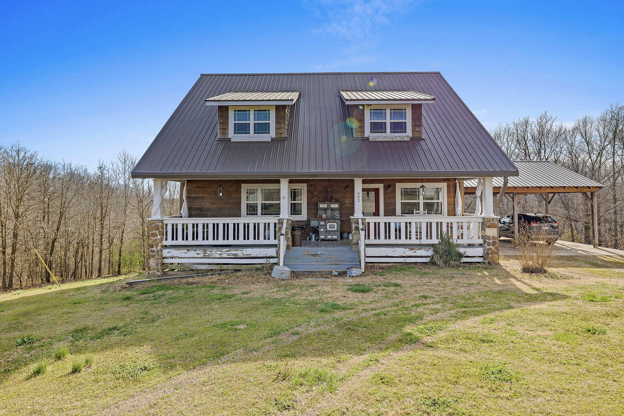 This one-of-a-kind opportunity is waiting for you! Two lovely homes on 5.6 plus acres with fabulous shop/barn six minutes from Bella Vista. What could make it better? Both homes together total 5100 s.f.,and you can store kayaks in the shop and have an Air BNB in the larger home!  See MLS #60289229 for 2800 s.f. home on 4 acres.  Interior pictures are of the 2800 s.f. home.