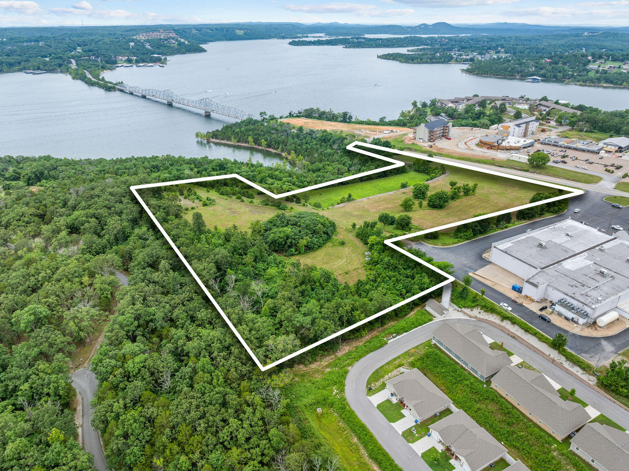 Prime Lakefront Development Opportunity! Almost 12 acres of stunning lakefront property ideally located right by the iconic Kimberling City Bridge in Kimberling City, MO. With gentle lake access and breathtaking views, this parcel is perfect for the developer with a vision. There's hardly any lakefront land left like this and especially with such easy access to everyday conveniences like the nearby grocery store, local restaurants, and all the charm Kimberling City has to offer.With its unbeatable location, size, and the growing demand for vacation getaways, this is your chance to bring a new resort or luxury condo community to life on Table Rock Lake. Don't miss the opportunity to turn this rare piece of lakefront into something extraordinary!