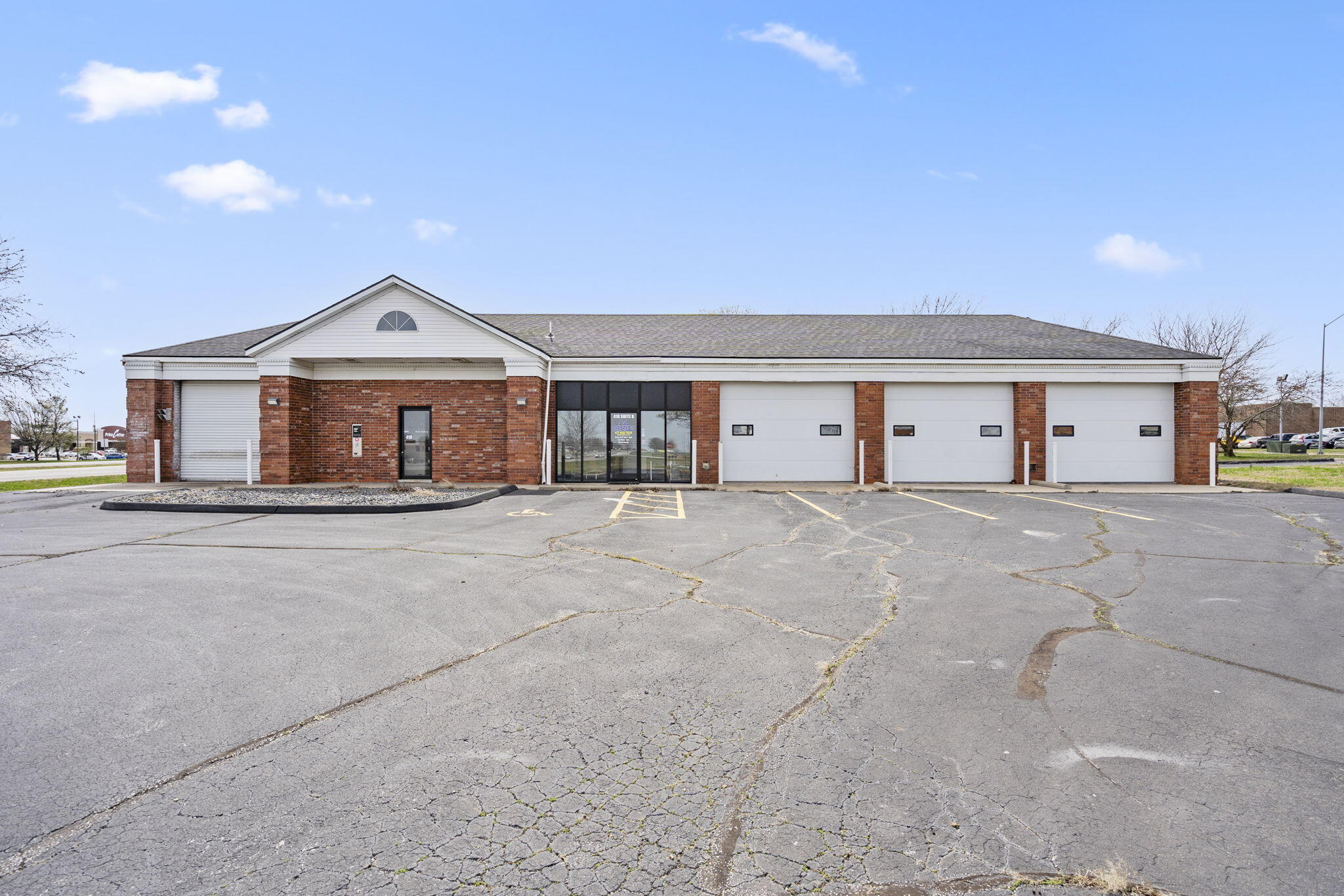 Prime Commercial Property in Nixa, MO - Amazing Location with High Traffic Visibility! Take advantage of this incredible opportunity to own a highly visible commercial property in the heart of the rapidly growing Wasson Development located in Nixa, MO.  Zoned HC (Highway Commercial District), this property offers unmatched visibility with 240 feet of frontage on Massey Blvd (Hwy 160) and 264 feet of frontage on Old Wilderness Road. With an annual average of 20,000 cars passing daily, this location is ideal for businesses looking to capitalize on high traffic exposure. Situated within close proximity to established businesses such as Cox Hospital, OakStar Bank, Applebees and more, this property is easily accessible via multiple points in this continuously growing location. The building spans 2,740 square feet and offers a highly functional layout, including three 10x14 bays with overhead doors on both sides, as well as a 10x10 bay with automatic doors on each side. Additionally, there is 442 square feet of office space that includes a back storage area and another 10x14 overhead door. The property also features a large storage room with both front and rear access, along with a small office and public restroom located at the front of the storage area. Previously used as a car wash, car lot, and storage facility, this property provides ample opportunity for transformation to accommodate a wide range of business needs. The land is included with the purchase, and the generous parking lot allows for potential expansion or the addition of self-service features, such as automotive vacuums at the rear of the building. All utilities are already available at the site, ensuring a smooth transition for your business operations. Located in a rapidly growing area with high traffic flow, this is a rare opportunity to secure a prime location for your next business venture. Reach out today for more information or to schedule a tour of this property!