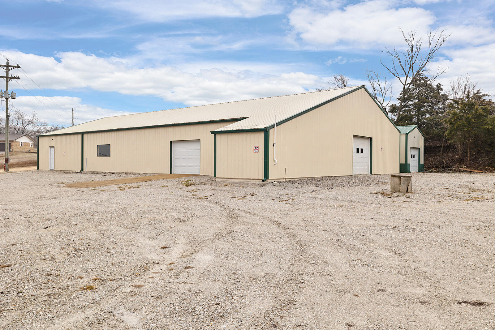 Discover an exceptional opportunity with this expansive 4,708 sq. ft. space, ideally situated just outside of town and perfect for any business. The lack of restrictions gives you the freedom to innovate and grow. The property includes one bathroom, providing the option to create comfortable living quarters in the back. Additionally, there's a versatile 16x24 secondary building, enhancing your possibilities.You'll appreciate the modern upgrades, including a brand-new septic system and well-tank with state-of-the-art equipment. The entire property is illuminated by energy-efficient LED lighting and features newly installed rain gutters. With access to single-phase and three-phase electric power, this space is ready to meet your needs. The large gravel lot offers excellent drainage, ensuring ample parking for your customers and employees. Don't miss out on this fantastic chance to invest in your future!