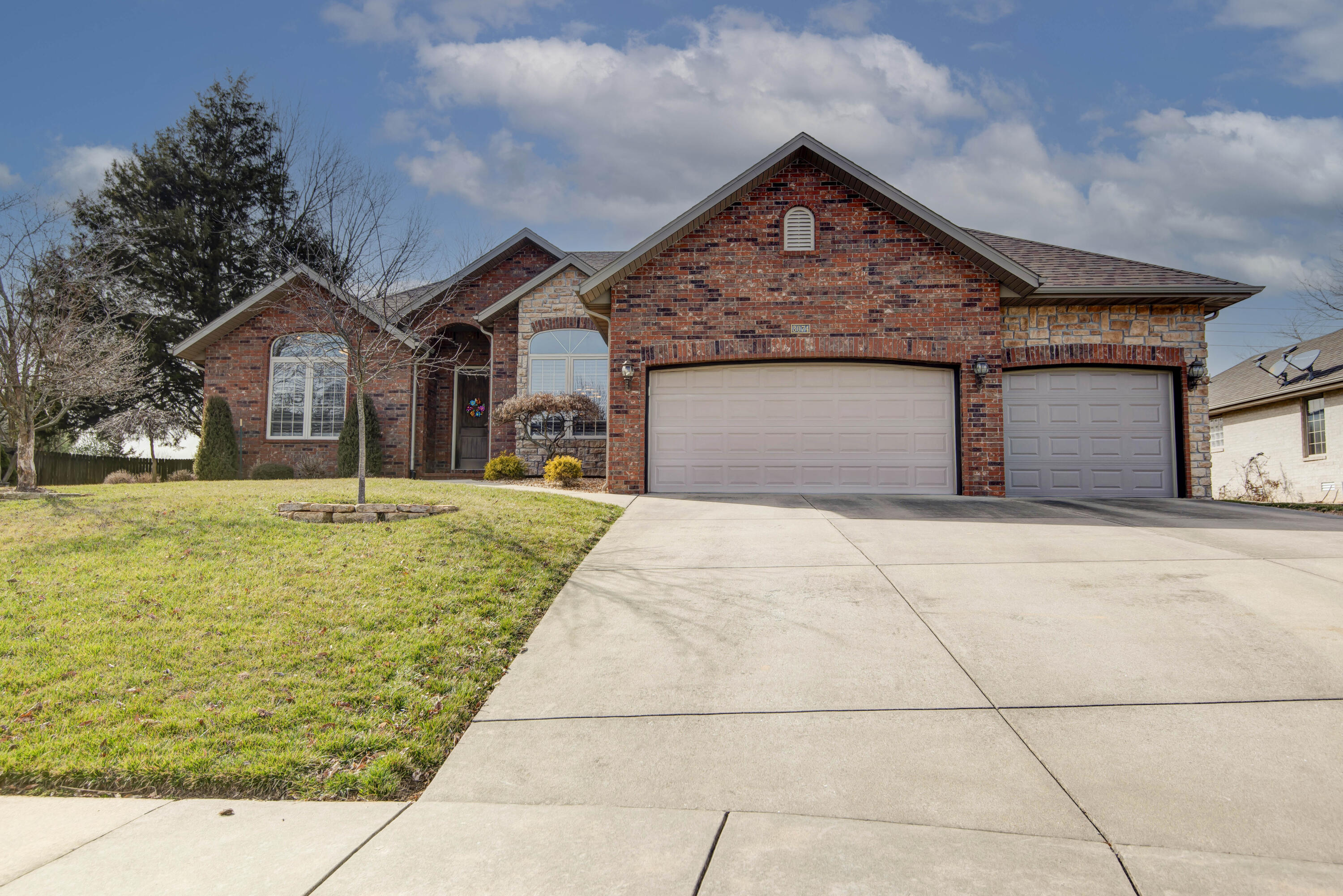 Beautiful all-brick 4-bed, 2-bath home in the highly sought-after Kickapoo School District! Located on a quiet street and in a quiet neighborhood of gorgeous homes, it is conveniently located within walking distance of McBride School and it's walking trails. Boasting over 2,100 sq ft of living space, this home features high ceilings, a great overall layout and desirable split-bedroom floor plan, providing privacy and comfort for the whole family. Enjoy the convenience of a 3-car garage for ample storage and parking. The bright and roomy 4th bedroom at the front of the home would also make a wonderful home office for the one working from home or play area for the kiddos. The large screened-in back porch is perfect for relaxing or entertaining and enjoying the incredible sunsets. Located on a cul-de-sac in an amazing neighborhood with great walkability, this home combines modern living with exceptional convenience. Don't miss the opportunity to make this beautiful property yours!