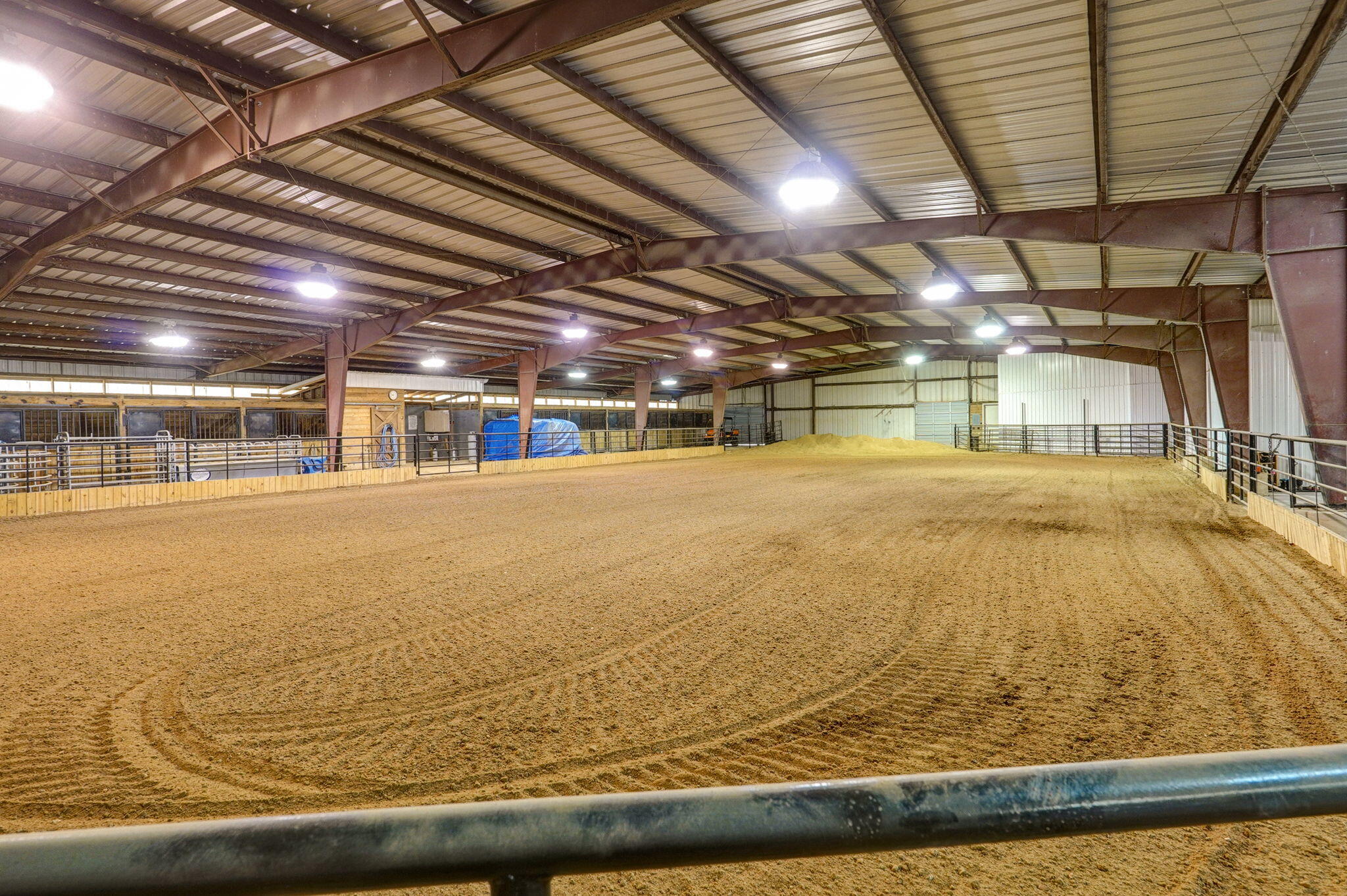 This remarkable 15-acre equine property features a commercial-grade 150 x 125 Red Iron Construction indoor barn, complete with a 150 x 75 indoor riding arena. The barn offers 15 stalls, including 2 stallion/foaling stalls, 2 tack rooms, and a wash rack. Additionally, there is a 110 x 90 outdoor arena and a 50 x 20 pole barn with a 24' loafing shed. The property also boasts 2 stocked ponds and abundant wildlife.Living quarters include 2 bedrooms, 1.5 baths, a spacious living room with an open kitchen, a separate dining room, an office space, and a bonus area currently serving as a hair salon. A 300 sq. ft. m/l screened-in porch adds to the charm.With its commercial-grade barn, riding arenas, and ample space, this property is perfect for a working trainer, boarding facility, equine layover motel the possibilities are endless. Just 10 minutes to Springfield.