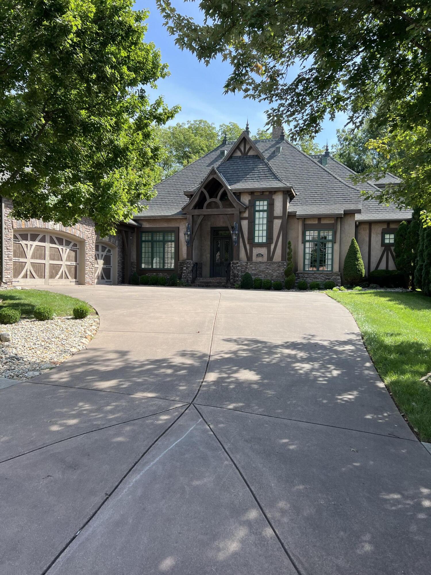 6326 S. Riverglen, Ozark,  MO - Old World design in Millwood Subdivision. Main floor offers a large kitchen/hearth room with gas stove, main floor master suite. Truly stunning details throughout.