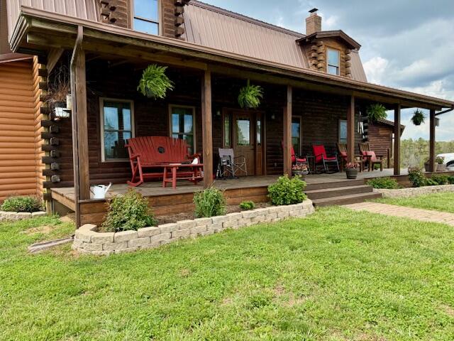 This gorgeous ranch style log home is sure to sweep you off of your feet, offers convenience, comfort, and ample space for the whole family. Situated on 80 acres offers a combination of pasture, woods and 3 nice size ponds. Enjoy the beautiful panoramic views while homesteading or hobby farming or that perfect hunting property! It simply does not get better than this! The woods and fields abound with deer,turkey,quail, rabbits, ducks, geese,etc . Step inside to discover a spacious interior, The Living Room which is adorned with a cozy fireplace - perfect for gathering with loved ones on chilly evenings, Large kitchen, breakfast room, large dining room, cozy sunroom,1/2 bath and utility room all on the main level, Upper level offers four generously sized bedrooms, two full bathrooms, this home offers plenty of room for everyone to spread out and relax. The partially finished basement has a large bedroom, family room, bath and lots of storage space. Step outside to discover a sprawling yard, meticulously landscaped, 56X30 3-sided building for storing equipment with an attached shop, 42X36 hay barn and 40X16 storage building ample space for storing belongings and equipment. The Large covered decks are Perfect for enjoying leisurely afternoons or hosting outdoor gatherings, - just waiting for you to move in and make it your own. Don't miss out on this incredible opportunity! There is an additional 160 acres available!!