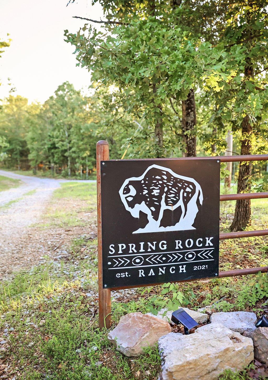 Endless Possibilities on 518 Acres of Pure Ozark Beauty! Discover the ultimate blend of natural beauty, modern comfort, and business potential with this breathtaking 518-acre property. Featuring an impressive array of water sources-- 2 wells one for glamping and livestock, 6000 feet of waterlines throughout to 5 tire livestock waterers, a large spring with watercress and holding pond, four additional springs, two year-round creeks, and eight serene ponds--this land is a rare and precious find.Perfectly suited for a glamping retreat, the property currently includes three fully furnished glamping tents, a shower house that can be turned in to a residence or possibly 2 cabins, a camp store, ready for guests or your next big vision. Miles of UTV and hiking trails (7-8 miles) wind through lush landscapes, offering endless outdoor recreation.For those with agricultural or equestrian dreams, you'll find multiple pastures, a corral, and a spacious barn outfitted with a new 16'x48' metal lean-to, a 12'x16' concrete-floored room, and a 24'x48' section with 14' clearance--ideal for livestock, hay, or equipment. The historic blacksmith shop now serves as a charming chicken coop, complete with a 40'x60' pen, feed storage, and tack room. Eight hydrants and several waterers are strategically placed for optimal farm functionality.The beautifully remodeled 2-bedroom, 1.5-bath home combines rustic charm with modern upgrades, including new plumbing, Reverse Osmosis water filter, new wiring, spray foam insulation (2023), metal roof, and Hardie board-and-batten siding. Enjoy custom white ash cabinetry, warm barn wood accents, crisp white shiplap, and a sunny four-season sunroom with sweeping views of your land.Top it off with a welcoming greenhouse and hot tub--your personal oasis for relaxing in nature, year-round.Whether you're dreaming of a private estate, income-generating retreat, or sustainable homestead, this extraordinary property is the canvas for your next great adventu
