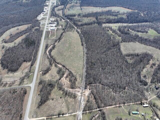 Uniquely situated very close to I-49 and abutting the city limits of Anderson, while lying just outside thereof, this 178 acre (+or-) tract of ground has been owned by the same family for more that 150 years and they are now ready to pass the baton. This property sits just off Business Highway #71 and is bordered by Hagee Road on the North; with a good mix of cleared land/pasture and timber. The cleared portions are currently fenced and utilized for cattle operations and boast several beautiful and healthy ponds; while the timbered portions could be utilized for hunting or recreation and feature several acres of mature timber. With housing development and city expansion planned nearby this property certainly has the potential for a bright future and beckons you to take a look.