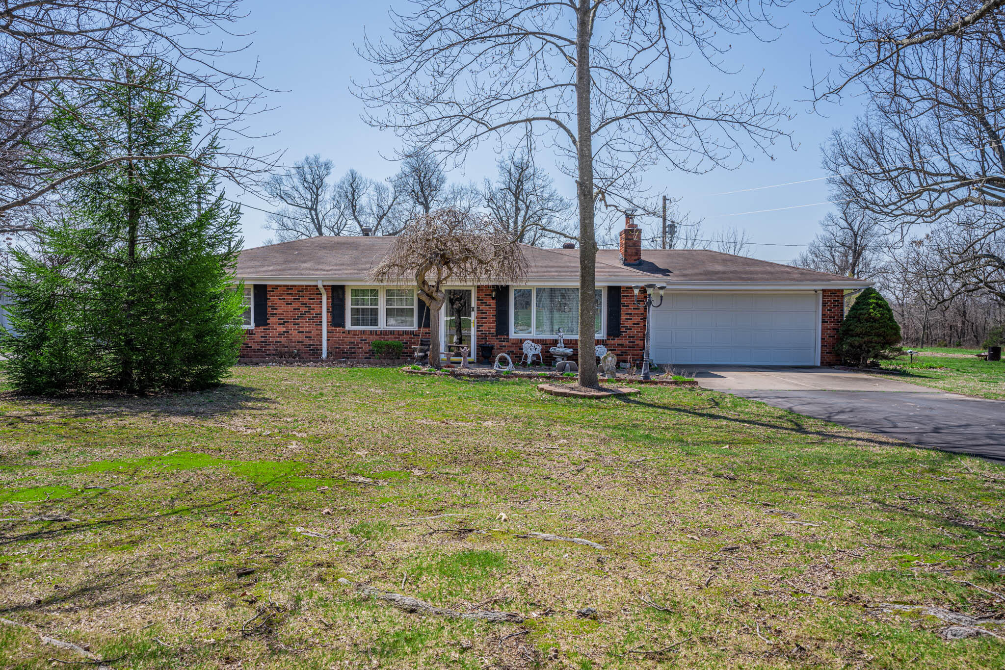 This spacious property features a 3-bedroom, 2-bathroom home with 2 living areas, offering ample space for entertainment and relaxation. With 10 acres of land, it provides an opportunity for country living without compromising on the convenience of city life. The property is conveniently located near I 44 and James River Freeway, just 5 minutes away from Republic and other amenities.The hardwood floors throughout the home create a warm and inviting atmosphere, and the bedrooms offer comfortable living quarters. The well-maintained home is in excellent condition for its new owners.The property features a great deck with a hot tub, perfect for relaxing after a long day. It also includes a shop and other outbuildings, providing additional storage space and versatility for hobbies or work.This property offers a great location that combines the peacefulness of country living with the convenience of city amenities, making it an excellent opportunity for anyone seeking a comfortable and versatile living space.One owner home, trailer on property sold at no value.