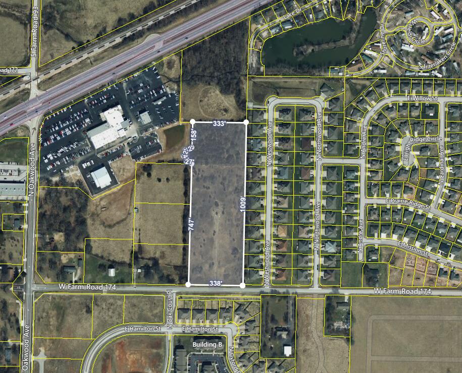 8.04 acres on north side of Farm Rd 174, east of N Oakwood Ave. Front 1.69 acres are zoned C-2 (commercial) and back 6.35 acres are zoned R-3 (multi-family).