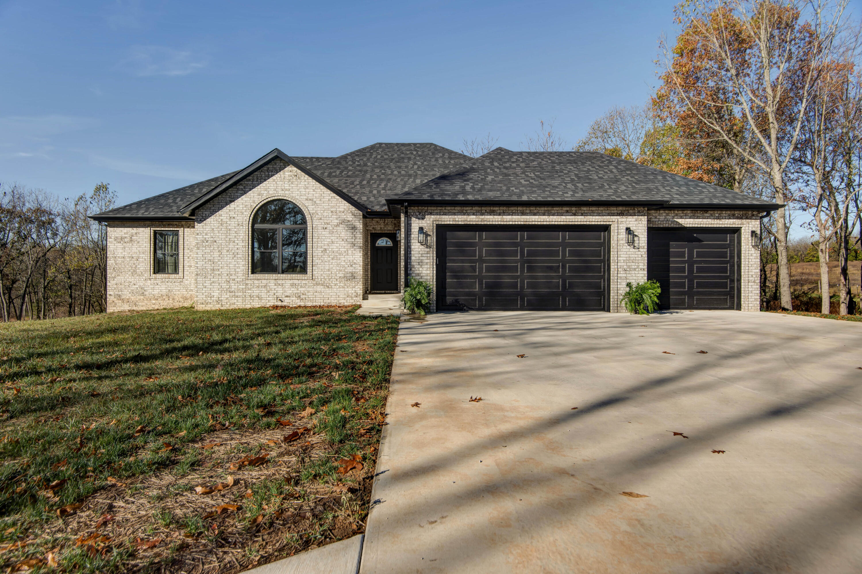 Discover luxury and nature with this all brick, walk-out basement home, on 34 acres of land! This rare retreat offers incredible privacy, an abundance of wildlife, a .5-acre pond and a winding creek, this home has it all! Building completion was August 2024, the home has all new appliances, roof, a private well and a 1250 gall septic tank. Come explore this open concept living space with vaulted ceilings, the kitchen is a perfect blend of style and functionality. Stainless steel appliances, Sharpe convection oven, large kitchen island, 4-gas burner stove top, the kitchen also offers a kitchen/dining area a perfect central gathering point for family and friends. The walk-out basement offers a perfect extension of your home! With an additional bedroom and full bath, the basement also provides a stylish wet bar, large storage space for all your needs and a built-in storm shelter for added peace of mind. Take your time exploring this beautiful property today!