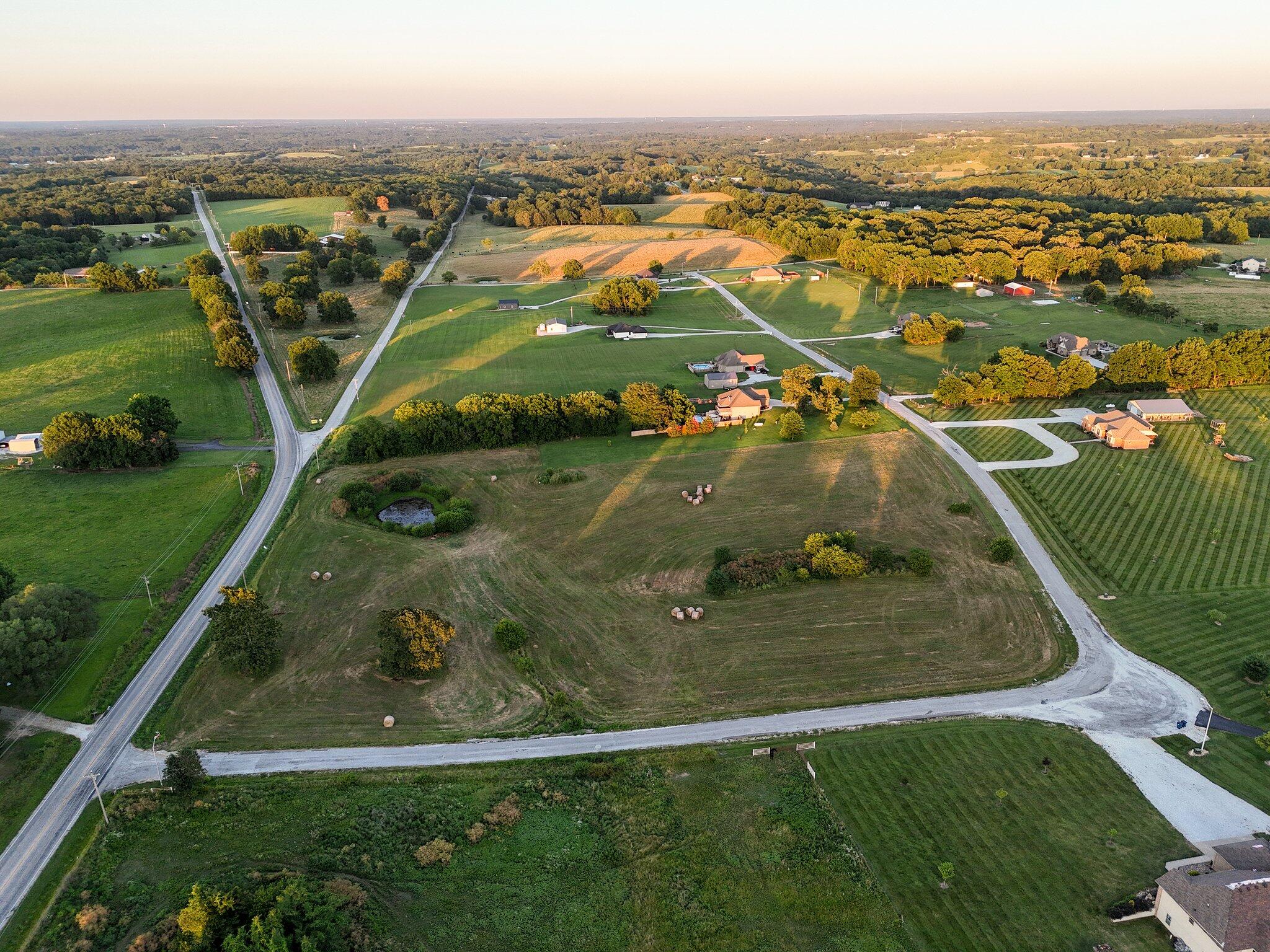 Gorgeous setting between Nixa & Clever surrounded by higher end homes and a country setting. This 6.63 m/l acre lot is ready for a custom home - whether it be a one level ranch, split level or basement home. The few restrictions in the community will help ensure your custom home keeps its value for years to come. Convenient to Clever, Republic, and Nixa.