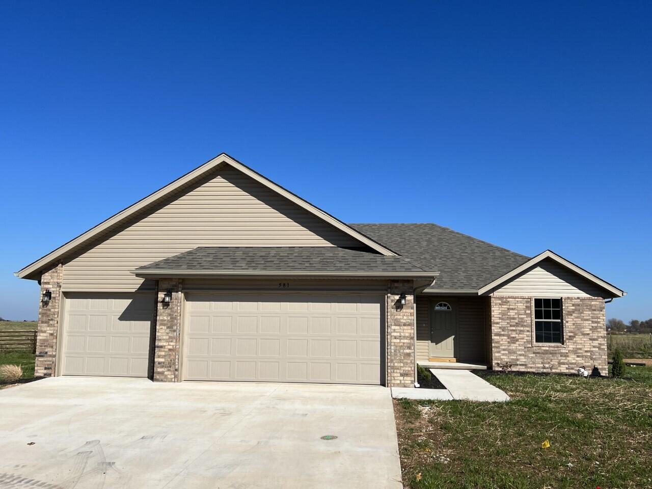Beautiful and move-in ready home in Ozarks desirable location! This home is 3 bedrooms, 2 baths and 3 car garage. Open kitchen, walk-in pantry, vinyl plank flooring, covered patio, privacy fenced yard and much more. Call today to schedule your showing!