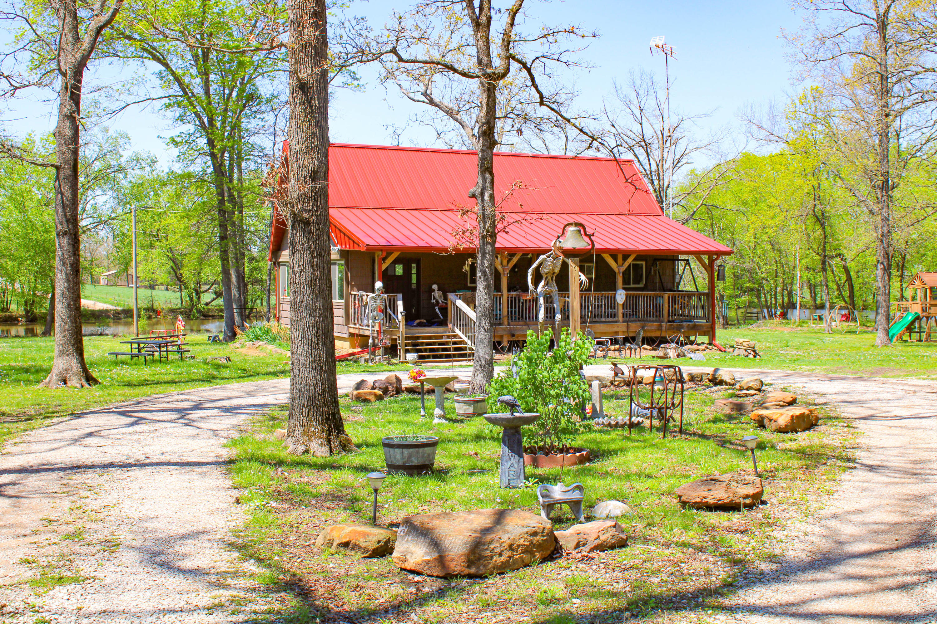 Check out this incredible 140 +/- acre property that is perfect for hunting, recreation, or even a mini farm. The main house is a cozy 3 bedroom, 1 bath cabin approximately 1,456 sq ft sitting on a full walk-out basement, providing plenty of space and lovely views. You'll also find a brand new 30 x 60 metal building, great for storing tools or equipment. This building would make an amazing home as well. It is a blank slate ready to be completed with your personal touch. There's another building that has some fire damage but is still useful for storage. The land features two ponds and a natural flowing spring, making it a peaceful retreat and a great spot for wildlife. This place is ideal for deer and turkey hunting, plus you can forage for wild mushrooms and pick fresh blackberries throughout the season. Located in the Appleton City School District and close to several lakes, this beautiful property is a fantastic opportunity for anyone looking for a piece of nature to enjoy. With easy access to nearby amenities while still offering the privacy and tranquility one seeks in a retreat, this property is a rare find. Whether you envision building your dream home, establishing a hunting lodge, or simply utilizing it as a private playground, the possibilities are endless.If you are looking for you own private hunting property this one has it all. This property sits just about a mile north of B Highway in the western  St. Clair County. Discover the ultimate retreat with this stunning 140-acre property nestled in the heart of nature. This expansive mostly wooded landscape is a true gem for outdoors enthusiasts, offering unparalleled opportunities for deer and turkey hunting. With its rich biodiversity and abundant wildlife, this land is an ideal sanctuary for both seasoned hunters and nature lovers alike. As you explore the property, you'll be captivated by the dense forests and rolling terrain, providing both seclusion and accessibility.
