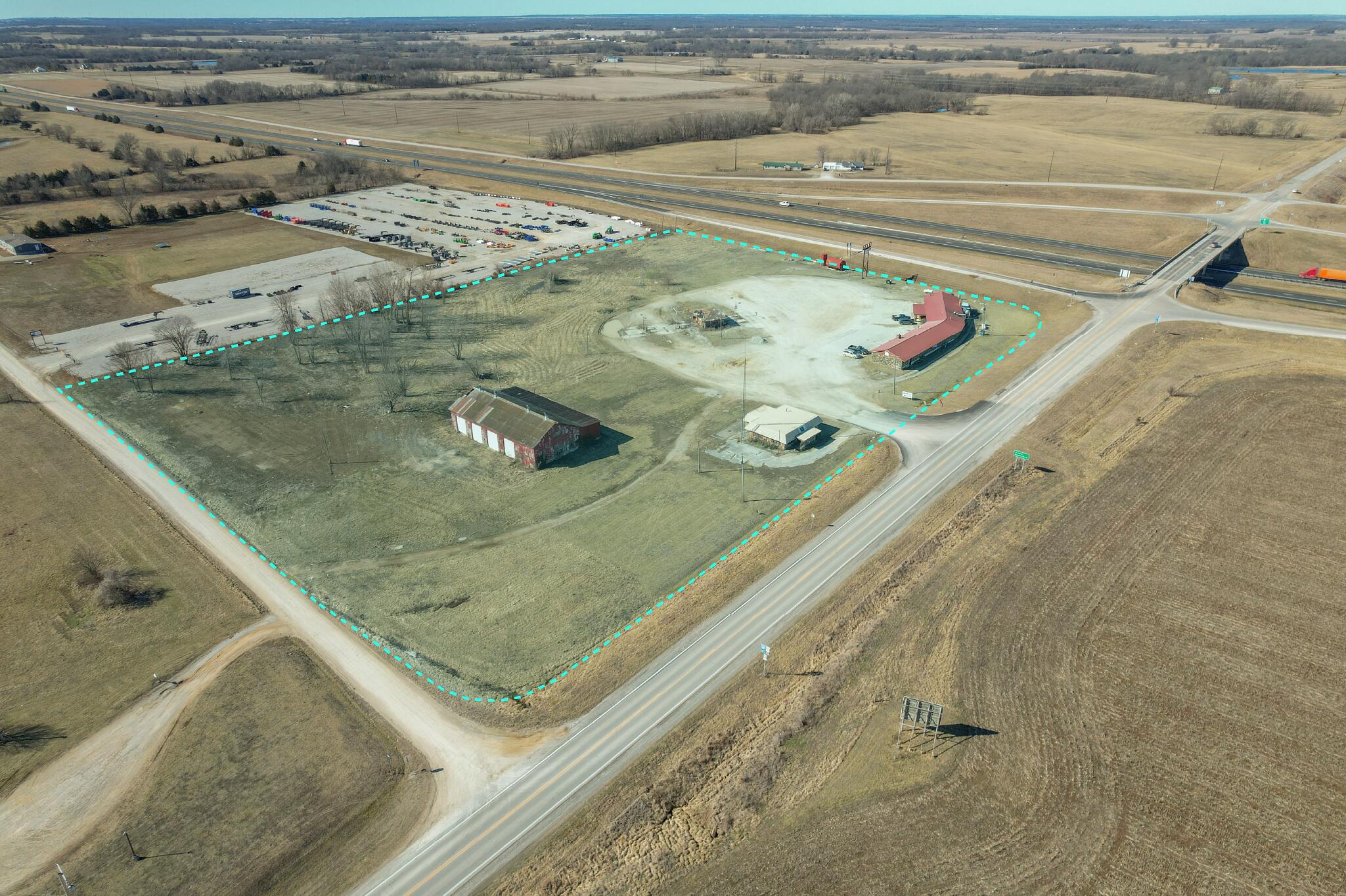 Excellent location located on US Hwy 71/49 within 45 minutes N of Joplin and 1-hour 1/2 S of Kansas City. Traffic also goes through Highway B to go to Stockton Lake popular for boating and camping.Property has 40,000 gallons of above ground storage tanks from previously being operated as a Truck Stop, large shop that previously was used for semi maintenance, restaurant and lounge currently open on a monthly lease. This property has great potential to be your next investment property with endless potential rather it be a Truck Stop/Convenience Store or a retail business (Jones Boot Store is located in Sheldon and has been a popular stop for visitors off of Hwy 71/49 for many years). Owner is open to any reasonable offers.