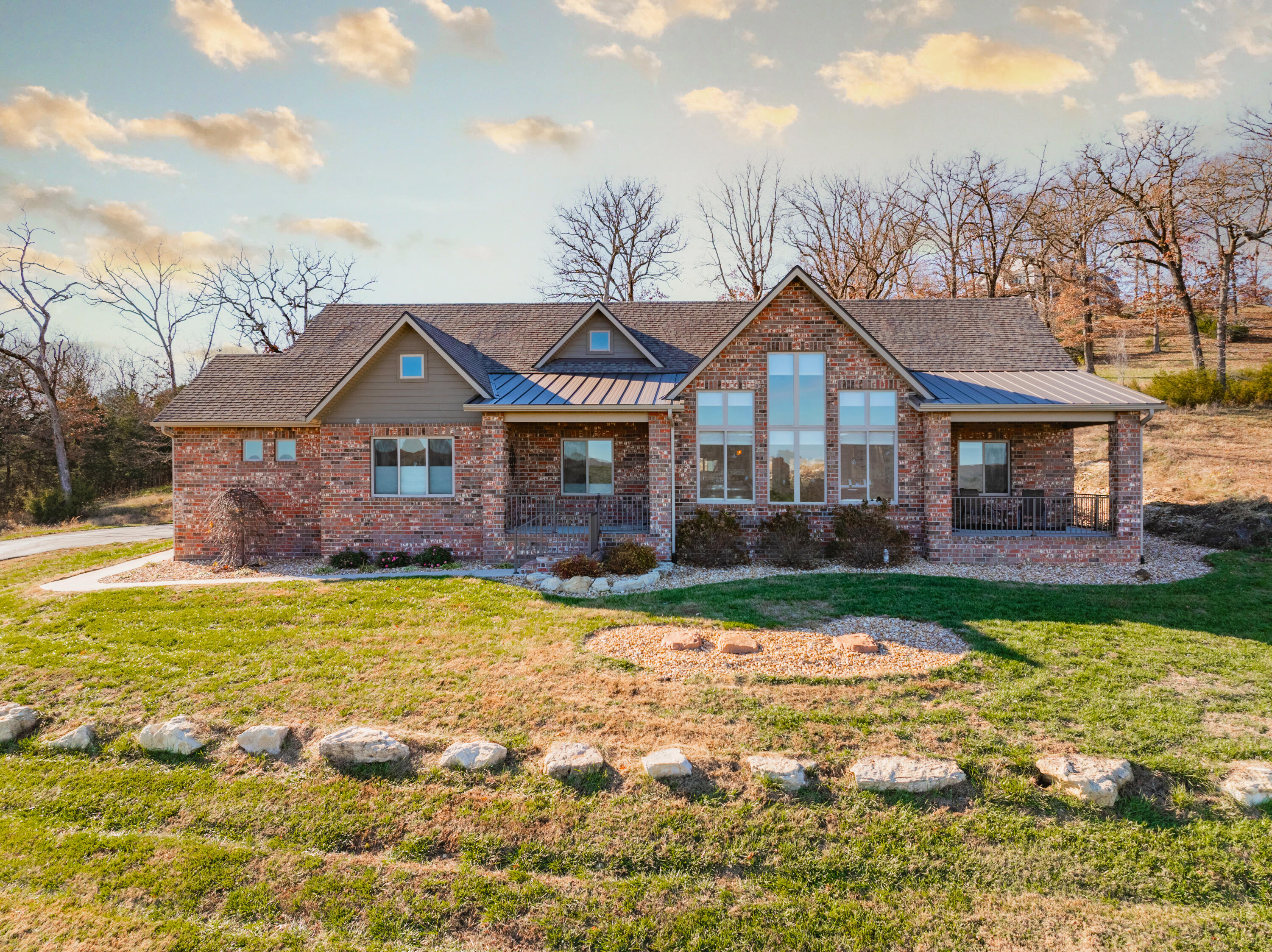 Welcome to your dream home! This charming all-brick residence features 3 spacious bedrooms, 2 full baths, and a dedicated office, all complemented by a spacious 3-car garage. Set on over 2 acres of serene setting, this beautifully designed home offers more than 2,400 square feet of elegant living space, complete with stunning views.Step inside to discover a chef's paradise featuring a gourmet kitchen with a large island, gorgeous granite countertops, and an abundance of cabinetry. The kitchen is equipped with high-end appliances, ideal for culinary enthusiasts. The luxurious master suite is a true retreat, showcasing a tray ceiling, an expansive walk-in closet, and a spa-like bathroom with a double vanity, a soaking tub, and a beautifully tiled shower.Additional highlights include convenient linen closets, a well-appointed laundry room with granite countertops and ample shelving, and an extra room in the garage that can serve as a hobby, exercise, or craft space. The home is equipped with a water softener for added comfort, and the rear porch is prepped with electrical for a hot tub installation, perfect for relaxing evenings.Enjoy the community amenities, including a community room, pool, and pavilion, along with access to a 40-acre park with scenic walking trails. This home offers high-end finishes and the tranquility of nature, making it an ideal sanctuary for anyone seeking a perfect balance of luxury and comfort. Don't miss out on this incredible opportunity!