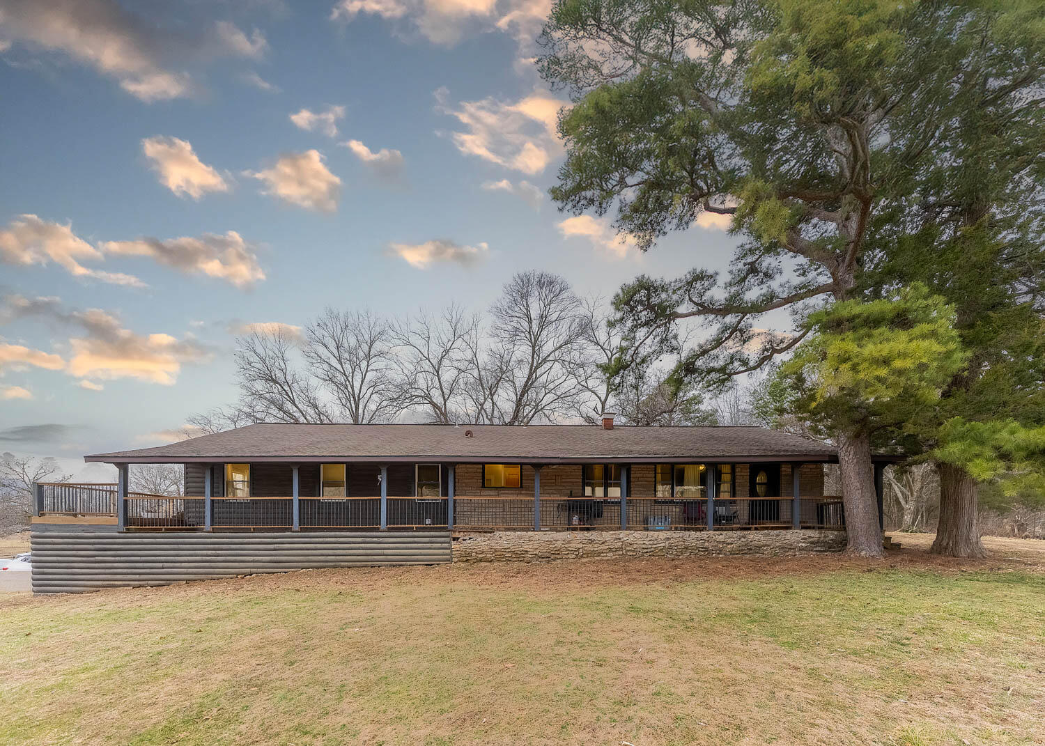 Set on 56 acres with 41 acres of open pasture and 15 wooded, this equine-ready property is a horse lover's paradise. The 4-bed, 2.5-bath home, built in 1950 with a 2008 addition, offers an open-concept living, dining, and kitchen area with original hardwood floors. The primary suite features a jetted tub, two sliding doors to a 3/4 wraparound porch (partially screened and plexiglassed), and all bedrooms include walk-in closets. A Generac generator, outdoor wood furnace, and water softener add comfort and reliability, while the 2-car garage (basement level) houses utilities and offers one automatic door. For canine companions, a dog door leads to the screened porch, with two more doors opening to a fenced dog yard, plus a built-in doghouse under the porch. The property includes four barns: Barn #1 (4822) has water/electric, Barn #2 (4654) has stalls, a tack room, electric, surround sound, and reconnectable water, Barn #3 is a classic red barn with water, electric, an RV hookup, and a chicken coop, and Barn #4 (10060) features an indoor arena and a 100140 outdoor arena, both with arena sand and an included drag. There are four ponds, two pear trees, cattle-tight fencing (six paddocks), and trails cut through the woods for extra riding space. A removable porch panel eases move-in, and the sale includes an LG propane stove, GE fridge, Whirlpool dishwasher, LG washer/dryer, and more. Abundant wildlife, lovely views, and well-kept grounds make this turnkey farm a rare find for anyone seeking a ready-made country retreat.