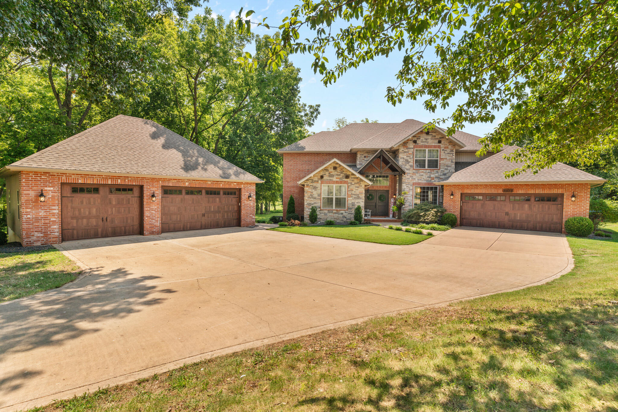 Discover unparalleled luxury and space in this stunning 2-story home, perfectly situated on 1.77 acres of picturesque land. Featuring 5 spacious bedrooms, 3 full bathrooms and 2 half bathrooms, this residence is designed for both comfort and functionality.This home shows out with beautiful wood beams and high ceilings that create a grand atmosphere and an open, airy feel. This beauty comes complete with 2 master suites and a dream kitchen. Enjoy the ultimate relaxation in the master bath, enjoy kicking back in the soaking tub that promises a spa-like experience right at home. Step outside to your private oasis, where you'll find an inviting in-ground salt water pool, hot tub, and you can entertain guests under the amazing cabana where you can watch the game on the 65'' TV. The home includes a 2-car attached garage and a bonus 3-car garage that provides ample space for vehicles, storage, workshop or the man cave of your dreams. This property is a unicorn located in Kickapoo School District and has the perfect blend of elegance, convenience, and efficiency in this exceptional home. Don't miss the opportunity to make this dream property yours!