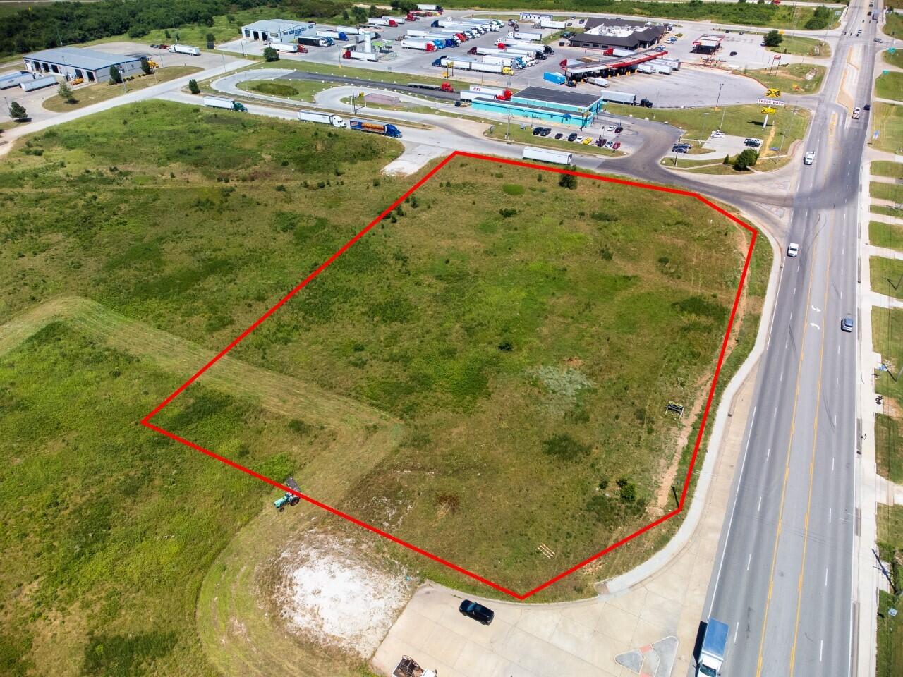Ready to be developed! High-traffic, corner lot location in city limits with quick access to both I-44 and Hwy 249. This parcel consists of approximately 3.8 acres. There are roads platted on the North and West sides of the property for the potential of road frontage on all four sides.