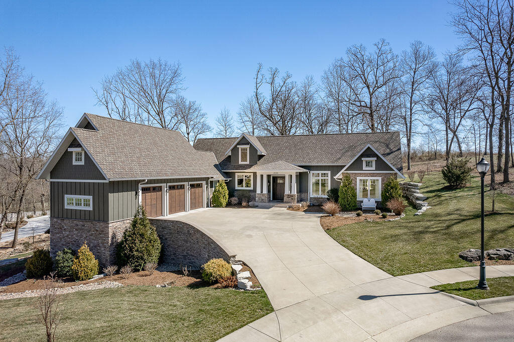 2840 S. Morningway Dr., Springfield, MO. - Gorgeous custom built home (by Herman Homes) located on a beautiful 1 acre lot in this exclusive gated enclave! Conveniently located in Southeast Springfield, this 4 bedroom 4-1/2 bath home features top notch quality and high end amenities. This 2019 winner of 417 Home Of The Year boasts an outstanding kitchen with Sub Zero Refrigerator, Miele gas stove and Quartz countertops. Main floor primary suite with spacious bath and closet area with built-in TV in the mirror, opens up to a private screened porch and patio to enjoy the view and wild life. Two additional main floor bedrooms, guest bedroom and family room on the lower level, finished bonus room as well as separate apartment/guest quarters with its own kitchen living area and bath that can be accessed from private entrance in the garage or from the main house lower level. 5'' wide plank Hickory hardwood floors, real stone fireplaces, Halo LED home purification and epoxy garage floors with custom built-in cabinetry are some of the many special features. Conveniently located near nature trail, restaurants and shopping. This is truly a rare opportunity to own a one of a kind high quality showplace. Shown by Appointment Only!