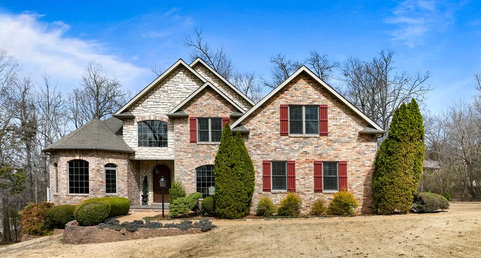 This custom 5-bedroom, 3-bath home (built in 2005) offers 4,081 sq. ft. of living space on .95 acres M/L. Designed for comfort and efficiency, it features high-efficiency foam insulation, central vacuum, and a vented gas fireplace. The kitchen boasts custom knotty alder cabinets, Corian countertops, under-cabinet lighting, a Culligan water filtration system, and a newer Whirlpool fridge (2022). The master suite includes his-and-hers closets, a soaking tub, and shower, with access to the wrap-around composite deck. Two upstairs balconies overlook the 17-ft ceiling living room, while sun tunnel skylights brighten the upper bath and 4th bedroom. Additional perks: heated/cooled basement workshop, Rain Bird sprinkler system, landscaped yard, finished attic storage, custom oak details, solid oak 8-foot entrance door, recessed lighting, and a 2-car garage w/ custom cabinet and utility sink. New furnace (2023). Additional land available--ask for details! Don't miss this exceptional, one-of-a-kind home with luxury finishes and thoughtful design throughout.