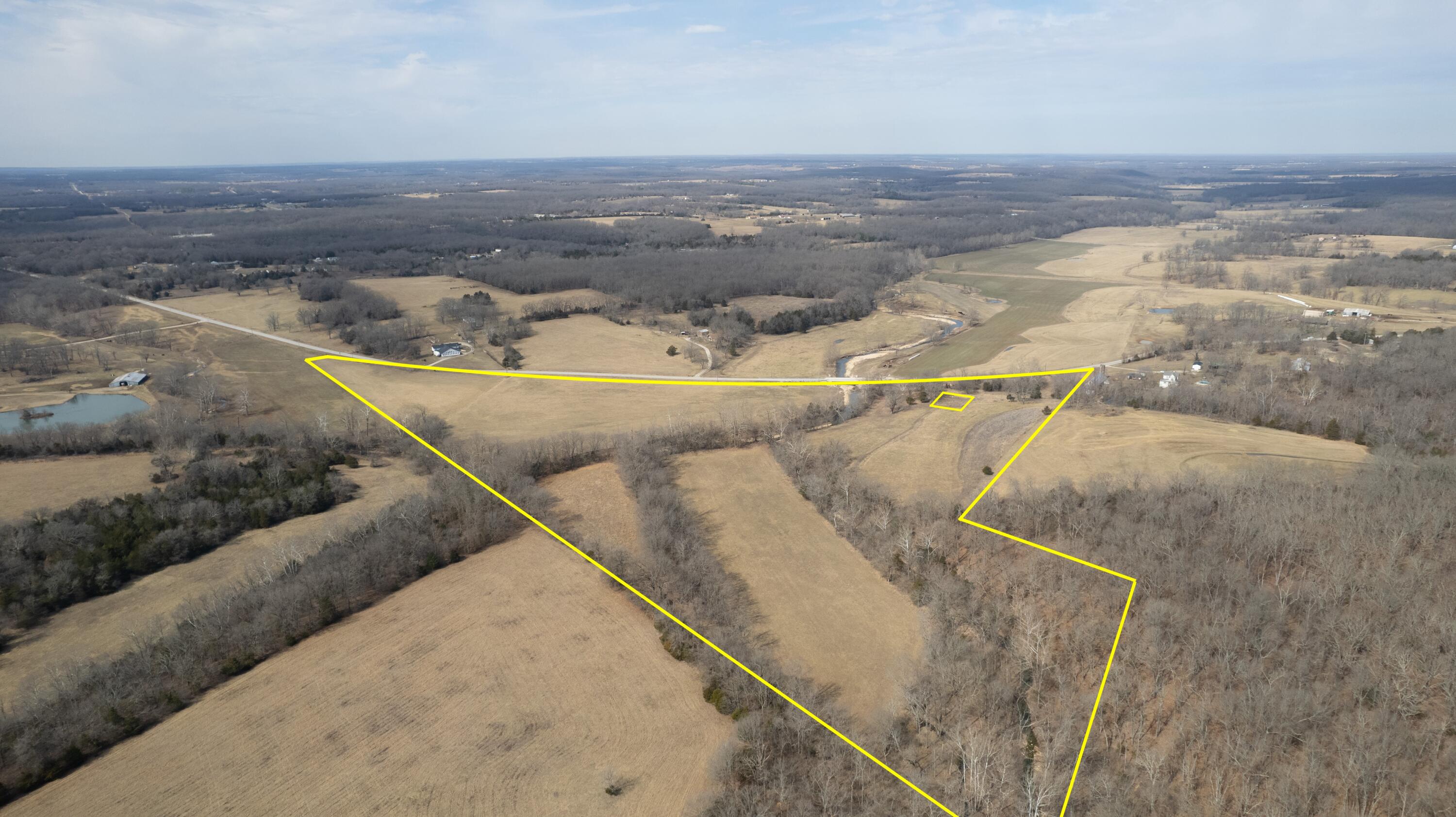 Beautiful 43.15ac of Productive Pasture Ground with Stunning Views, outside of Marshfield! Webster Co. This land is cattle tight, offers 1/4 mi of incredible, private creek access and nearly 1/2 mi of Historic Route 66 road frontage. Situated a short, 2.5mi from the new interchange at Exit 103... this fertile ground is level to mostly open, offers mature timber and a creek that feeds the East Fork of the Niangua River --running right through the middle. Enjoy summers by the water, hosting family & friends on your own gravel bar! The creek bank provides a nice travel corridor of cover for wildlife; there's plenty of opportunity to hang a stand or set a ground blind, too. This tract would make a great addition to your current cattle or hay operation and offers several great building sites for your future residence! The views are incredible! Blacktop frontage; Niangua Schools. Conveniently located just 4 minutes to Niangua's New Dollar General, 20minutes from Bucees in Springfield, 2.5hrs SW of St. Louis and 3hrs to KCI. Don't miss out on your chance to own this legendary property in the heart of Southwest Missouri; one that your family can enjoy for generations to come! Call today for your private viewing.