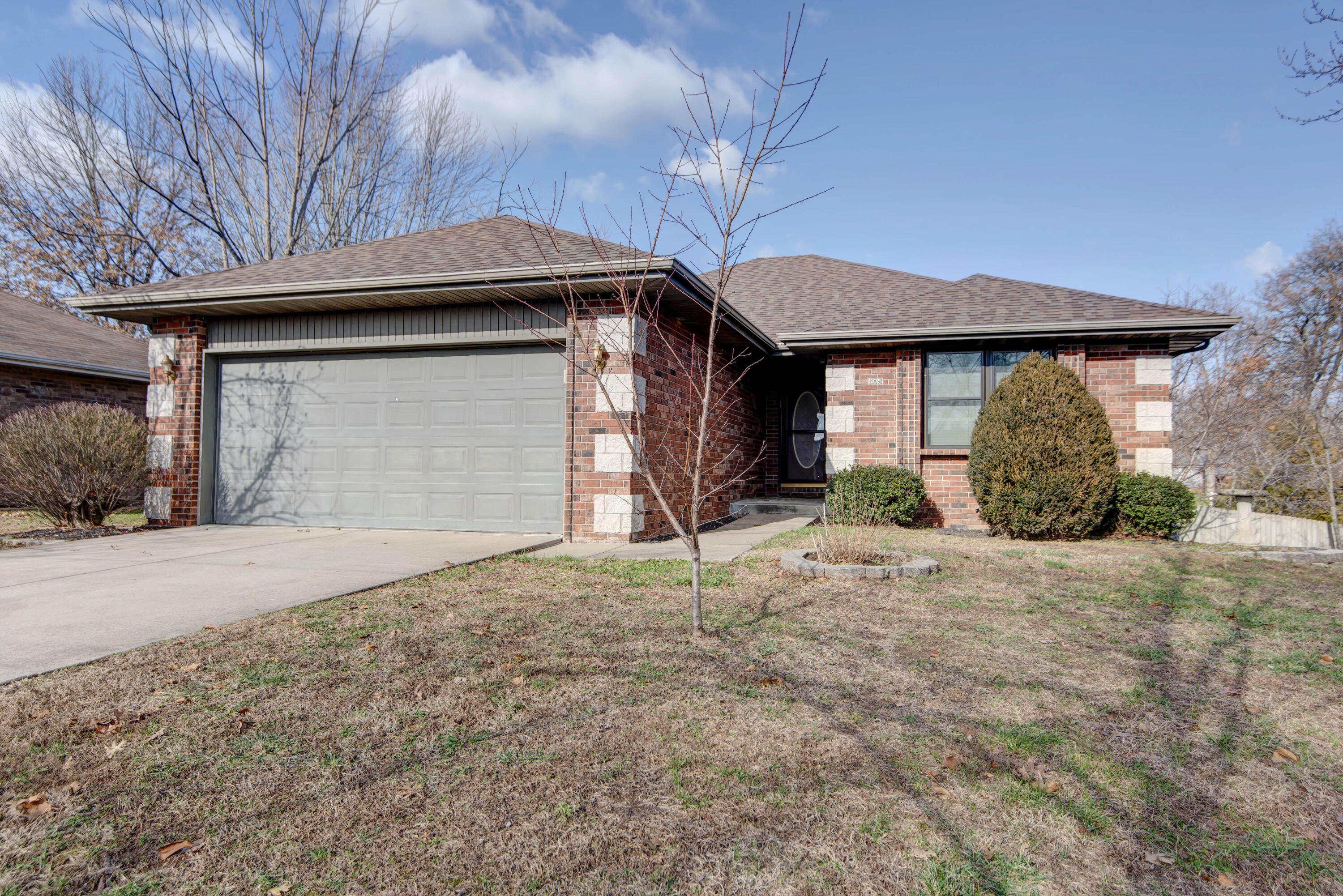 Come see this all-brick, 4 bed, 3 bath, walk-out basement home featuring an incredible 30'x40' insulated shop with in-floor heat, offering year-round versatility for work, hobbies and storage. Don't miss this nearly 3000 square foot home with rich bamboo flooring throughout much of the main level and plenty of storage inside and out for all your things. Split bedroom design with the master, two more bedrooms, and the laundry on the main level. Don't miss the large custom walk-in closet in the lower level bedroom which the current owners used as their master bedroom, an adjacent full bath, 2nd living area and bonus room. For peace of mind, the roof is just 3 years old. HVAC was replaced in 2019 and new windows installed in 2021. The back yard is fully fenced and there's a 20'x30' carport in front of the shop, providing additional covered space for vehicles, equipment or for storing the boat, RV or whatever you have. All this on a 1/2 acre lot in the heart of Nixa! Check out the attached Features and Upgrades sheet.