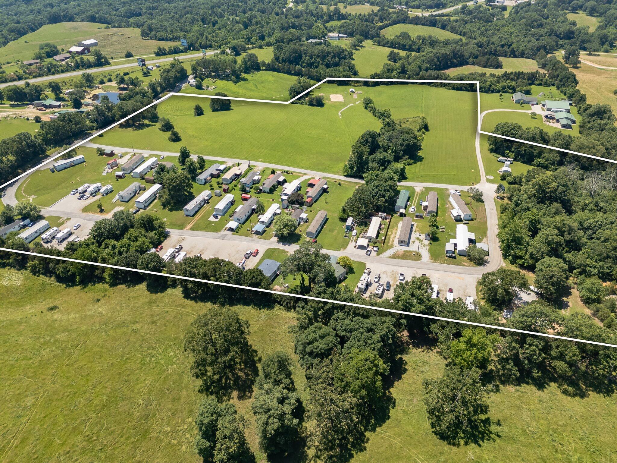 PERFECTLY LOCATED: STONES MOBILE HOME & RV PARK in the Heart of the Ozarks between BRANSON, MO & SPRINGFIELD on quiet, secluded Acres, ALONG WITH TWO HOMES AND A 60X60 SHOP BARN, INCREDIBLY EASY ACCESS on 36 Acres m/l just off MO-13/160 and outside of Spokane City Limits. Minutes to Table Rock Lake, Lake Taneycomo, Bull Shoals Lake, Silver Dollar City, Major Branson Entertainment, the Branson Landing, Golf Courses, Shopping, Big Cedar Lodge, Dogwood Canyon, Eureka Springs, so much more!  Exceptional Business Opportunity owned & operated by the same Sellers for the past 10 years who have upgraded and keep Park in immaculate condition now ready to retire and ''pass the torch.''  PARK IS 100% OCCUPIED with a Waiting List - 33 Mobile Home Lots & 21 RV Lots!  NO PARK-OWNED UNITS (Mobile Homes, Tiny Homes or RV's) and no Subletting allowed.  Lot Rents are currently below Market Rates.  This is a Self-Contained Park with its own Community Water Well and upgraded Wastewater Treatment Plant approved by DNR and professionally maintained (each location has a Transfer Switch in place by a Licensed Electrician for Generator Hookups). Underground Electric to all 54 Sites, Fiberoptic Highspeed Internet available to Park (RV Sites are already Hard-Wired and available).  Paved County-maintained Road through Park.  Impeccable Business Records.  Room to Expand & Grow having many Options.  List of Park Equipment and Misc. Park Supplies are Available. Ask your Realtor for a Copy of the Attached Information!