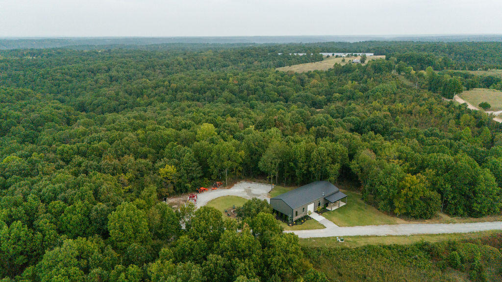 Midwest Land Group is proud to present this premium 139+/- acre hunting and recreational farm in McDonald County, Missouri! The expansive farm has been meticulously developed over the years with every detail in mind in regards to deer herd management. The property boasts multiple food plots, established doe and buck bedding, multiple stand locations, and well maintained roads for easy access. Enjoy chasing 150+ inch bucks as that has become the farm standard. A thriving turkey population has also allowed for incredible hunts in the spring and fall. Your family or hunting club will enjoy the beautifully landscaped homestead that is situated atop one of the ridges, creating some breathtaking views. The craftsmanship is evident in the custom build 1,180 sq ft 2 bed 2 bath home with stone fireplace and beautiful cabinetry. The 940 sq ft attached garage/shop is perfect for working on projects and storing equipment. This farm was created as a true hunters paradise. Many incredible hunting stories have been created here and many more are ready to be made!