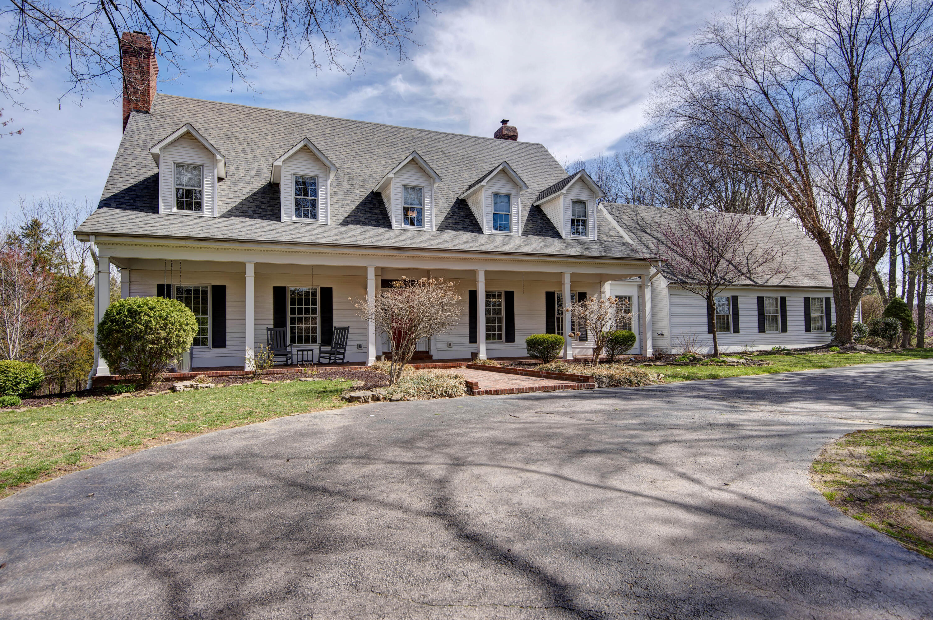 Fantastic SE Springfield farmhouse on approx. 3/4-acre lot in a wonderful, gated neighborhood.This lovely property features 3-levels of well-thought-out home: First floor has a large great room, study w/gas fireplace, formal dining w/butler prep area, kitchen w/ hearth room and pantry, mud room w/lockers, screened patio, and the main bedroom suite w/spacious closet, walk-in shower and corner tub. The second level has 3-nicely proportioned bedrooms (one even has a fun loft).lastly the walkout basement has a wet bar, theater area, exercise space, and a rec. room, as well as 2-more large bedrooms and a finished space for hobbies.Some of the other amenities include large covered front porch, basketball court, children's play area, circle drive, 3-HVAC systems, 2-water heaters, 3-gas and one wood fireplace, and large private yard.
