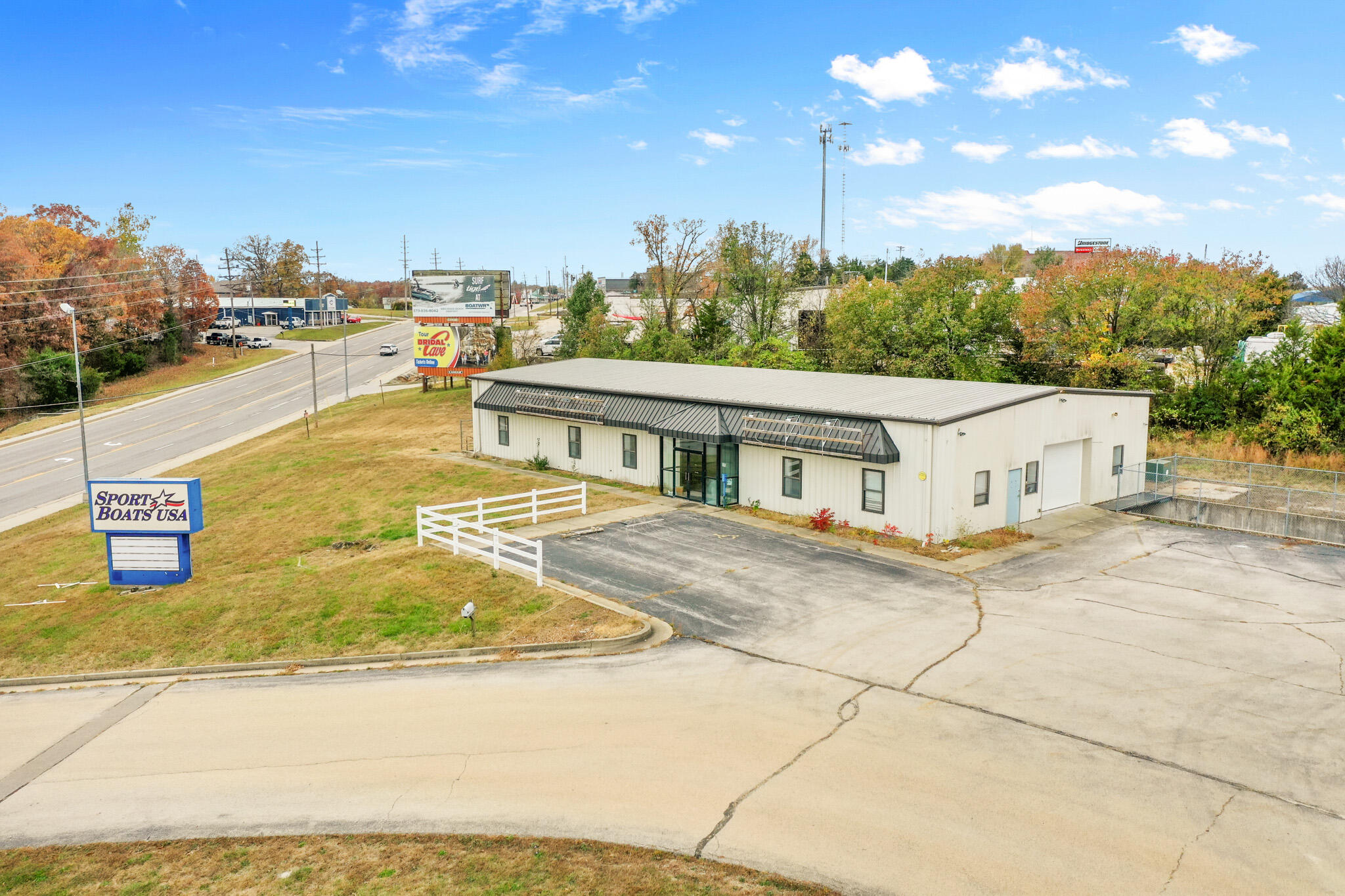 Prime Commercial Opportunity in Osage Beach. This 3.5-acre commercial property in the heart of Osage Beach includes three buildings designed to meet a variety of business needs. The main building is a 50'x100' open-span structure with a customizable layout, along with a basement that features a convenient loading area. The middle building is approximately 2000sqft and offers the perfect opportunity for office space, additional storage, or other flexible uses, while the back garage, approximately 2,700 sq. ft. with four overhead doors, is ideal for vehicles, equipment, or warehouse needs.This property also includes a highly visible monument sign that ensures maximum attention and drives business. Whether you're an entrepreneur ready to expand or an investor seeking a valuable addition to your portfolio, this property offers boundless potential in a prime location. With space to grow, customize, and succeed, don't miss this opportunity to make your mark in Osage Beach. Come and envision the possibilities!