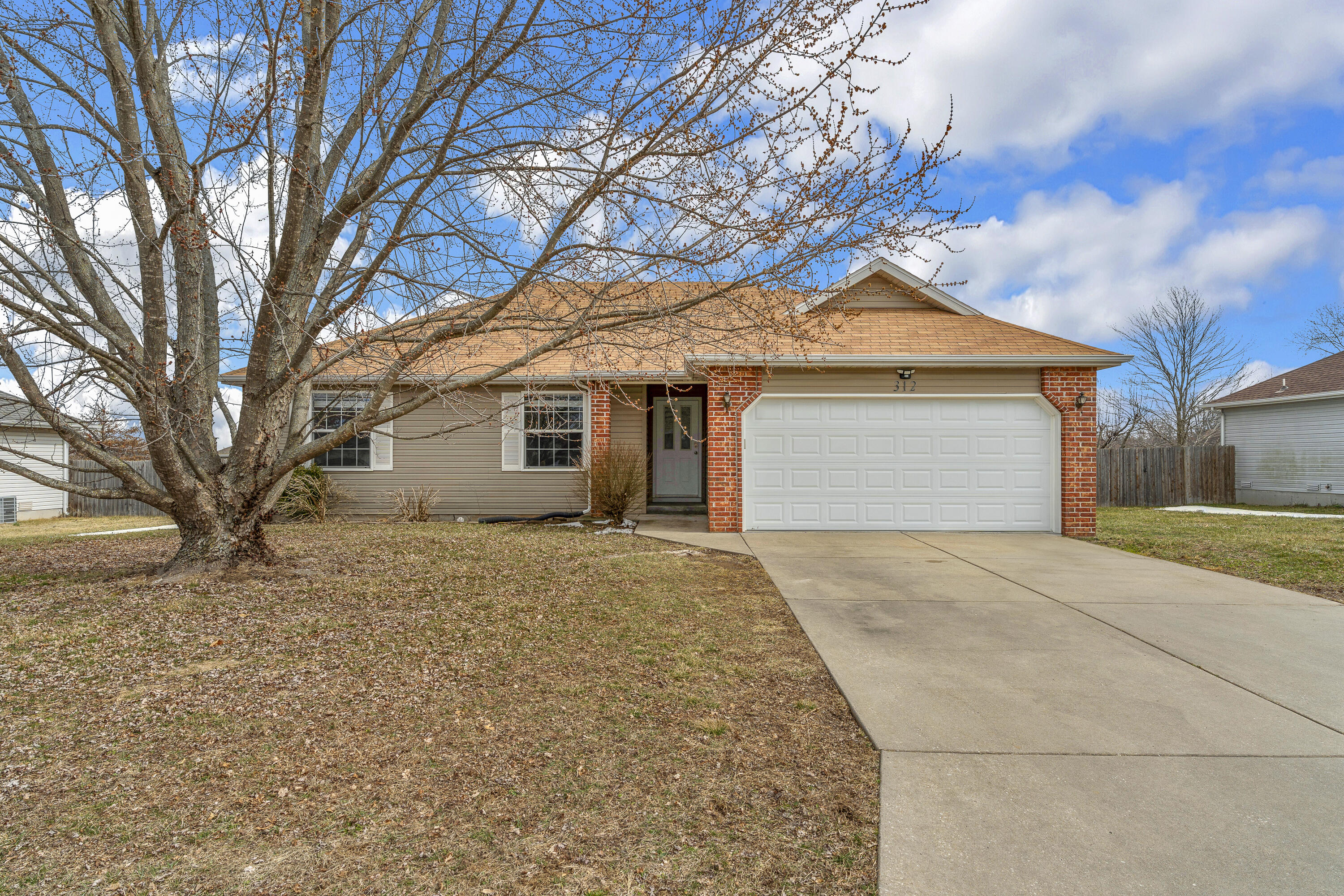 Welcome to this move-in ready, 3 bedroom, 2 bathroom home. This home is situated in a well-established subdivision right in the heart of Clever. The property is close to schools, the neighborhood grocery store, and all the other amenities Clever has to offer.When you approach the home, you will notice a 2 car garage, a 3 YEAR old roof, and a cozy front porch. Once you enter the home, you are greeted with a large living space and vaulted ceilings. Matching laminate floors continue throughout the main living space and into the kitchen. The kitchen offers tons of cabinets,  stainless steel appliances, and a built-in desk. A walk-in pantry located in the corner of the room is the perfect touch to complete this adorable kitchen. This home offers a split floor plan. On one side of the home, you will find a very spacious master bedroom. This room is complete with a large, attached bathroom and a big walk-in closet that has plenty of hanging space!On the opposite side of the home, you will find 2 more bedrooms, the laundry space, and a full bathroom.The large, fenced in backyard is another awesome feature this move in ready house has to offer. The backyard is perfect for pets, children, or a space to entertain. Schedule a showing today and don't miss out on this Clever cutie!