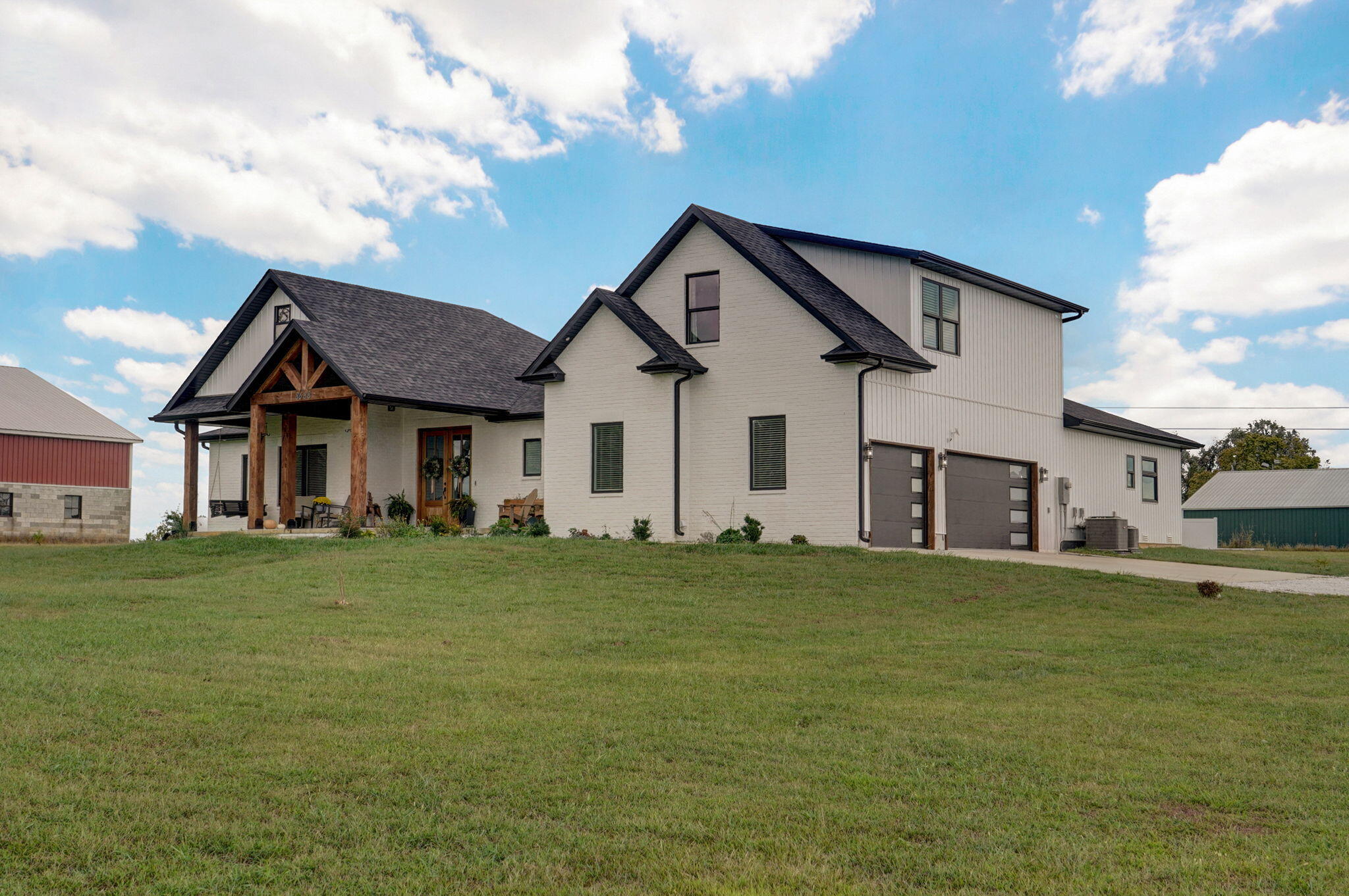 Welcome to the modern farmhouse of your dreams! This stunning home is situated on 2.59 acres with quick highway access and only 15 minutes from Springfield but in the highly-sought after Willard school district. From the vaulted, beamed ceilings, to the beautiful engineered hardwood floors, you'll find that no attention to detail was spared and no corner cut in the fine craftsmanship. Boasting a kitchen and butler's pantry that is a chef's dream and a functional lay out with the primary suite and 3 bedrooms on the main floor. Upstairs offers a huge bonus room with walk-in closet and a full bathroom, perfect for a media room or in-law quarters. The third bay in the garage has been remodeled to an office with heat and air. Outside, you'll love watching the sun set on the covered front porch or the screened in back porch. The property backs up to the Green Life Golf Course so you're just steps away from teeing off or hitting the fitness center! This quiet country golf course ensures that your little slice of heavenly real estate will remain peaceful with no neighboring homes. Every detail of this home is sure to have you falling in love!