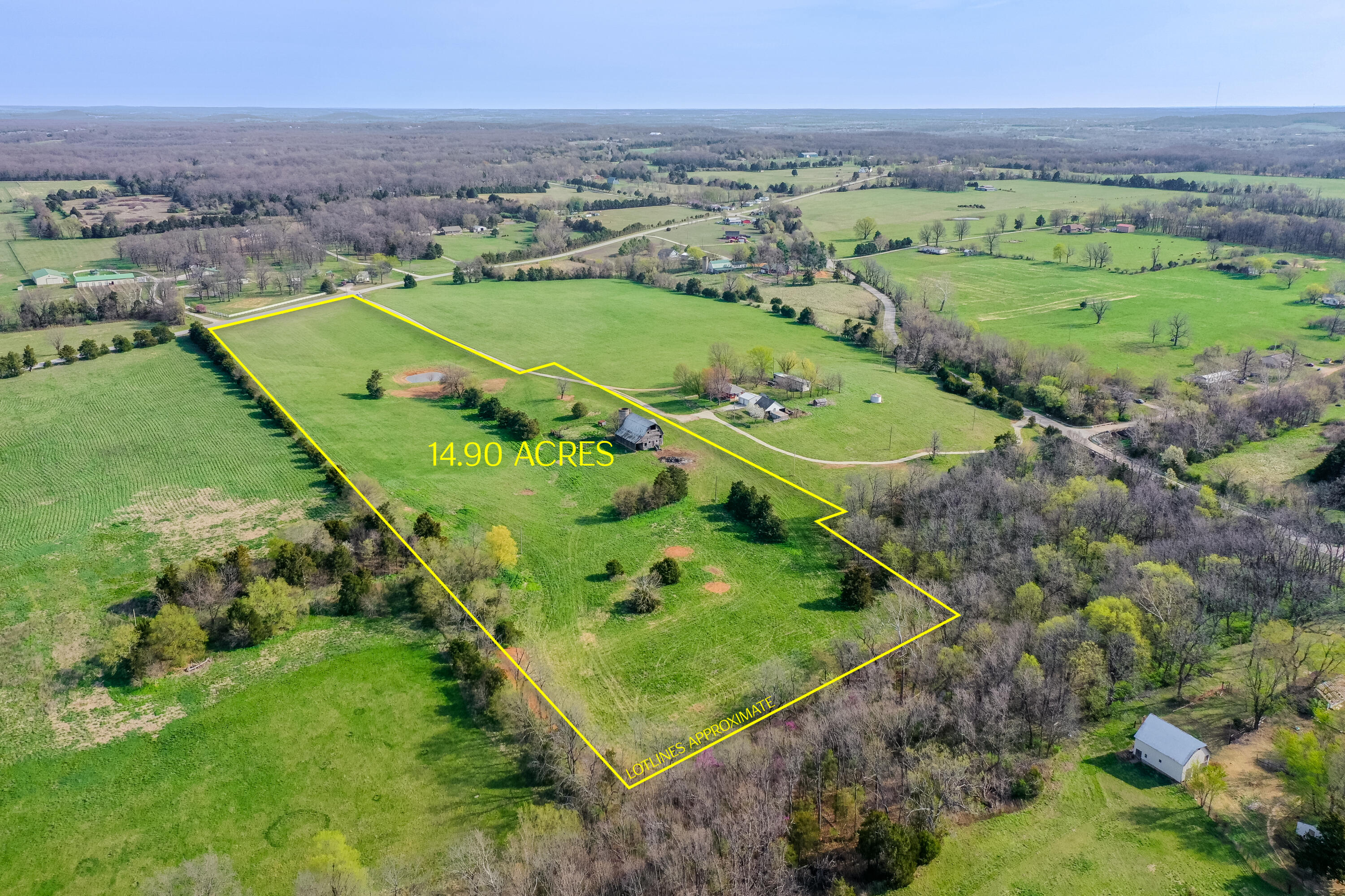 Properties like this don't come around very often in the perfect location. This beautiful 14.9 acre property has a Springfield address but is in Fair Grove school district. This property consists of cleared pastures, mature trees, a pond, a natural year round spring, and one of the coolest barns and silos I have seen in a long time. It has been meticulously maintained, fertilized, and produces some awesome hay. This would be a perfect spot to build your dream home, run cattle or horses, have a hobby farm, or all the above with no restrictions. The seller had this property surveyed and is willing to sell all 25 acres together or split into 2 parcels. One parcel would be 10.58 acres to the left side of Hummingbird lane. The the second parcel would be 14.9 acres on the right side of Hummingbird lane.