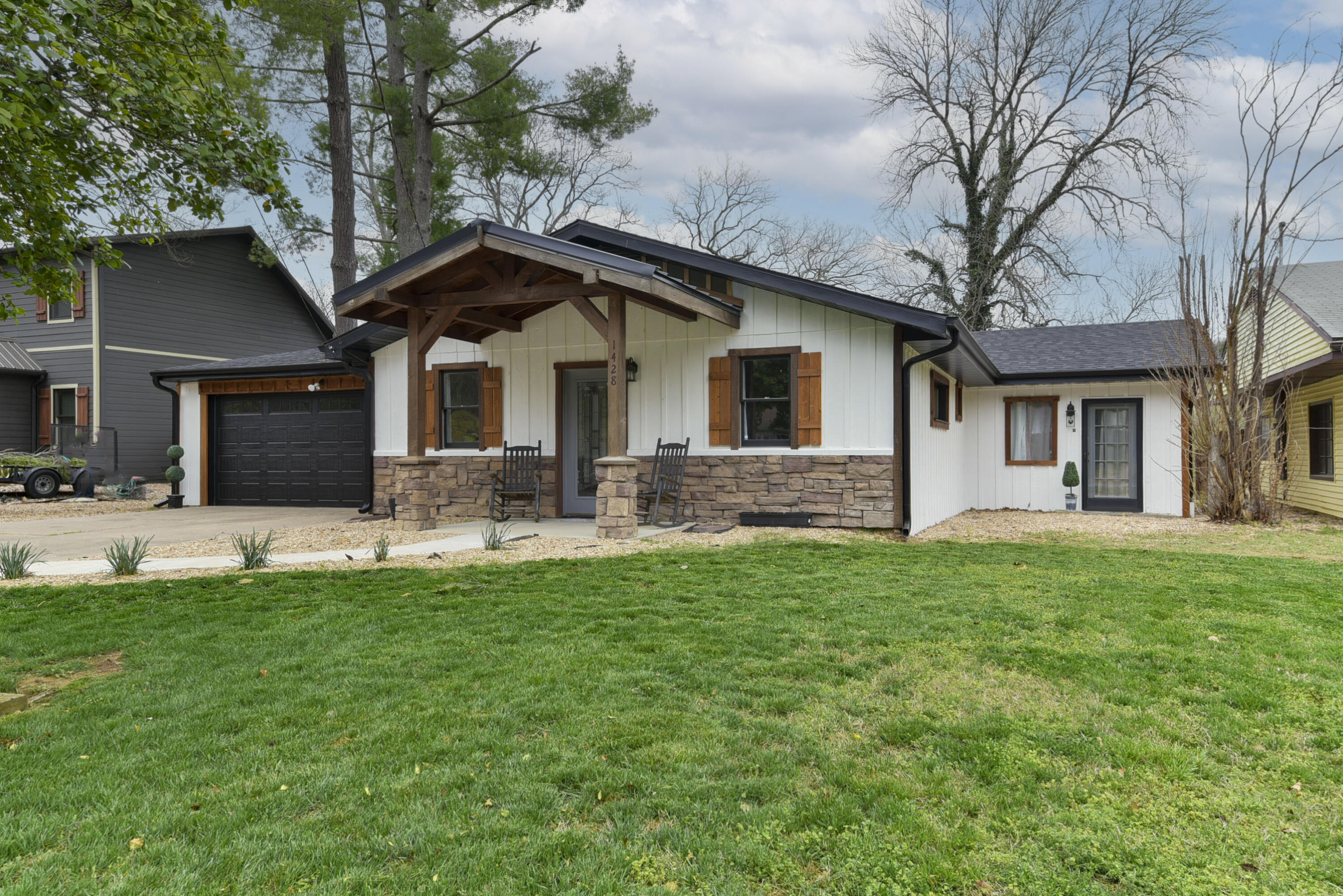 Living on the lake can happen here.  Lake Taneycomo is beckoning you. Simply step out the back door and you will find Lake Taneycomo and a private boat dock. Beautiful views of the lake is yours all day long from the outdoor living on the back concrete patio or the available wooden deck going down to the water and dock. The 4 BR/2 Bath home is completely updated (luxury vinyl flooring, carpet, new roof, electric up to code, fire sprinklers, smoke detectors).  Kitchen/Dining/Living room affords an open look and captures an easy living family atmosphere. The 4 bedrooms are spacious. A 2 car garage and parking for your guests is available.  Whether this will be your home or a long term rental, a great value is here and now available. Another asset for the property, it is not in the flood plain. Big Cedar, Branson, Silver Dollar City and world class golf are are a short drive away. Great location, a quiet neighborhood, together with the hushed call of the wild (trout) daily for those who listen. FYI- Record lunkers have been caught not far from the private dock. Boat dock is included in listing price.