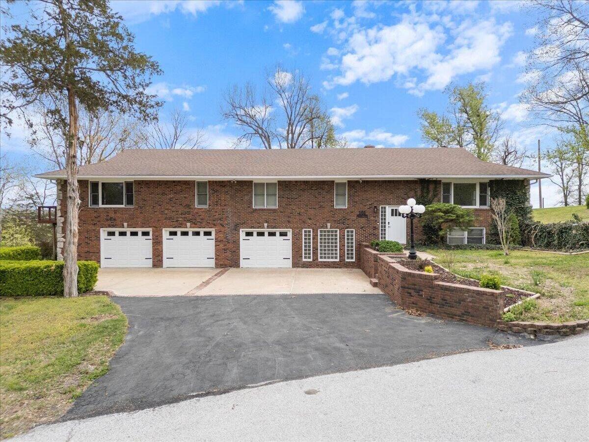 Welcome to Pineville, Missouri and Cedar Hills Subdivision!  If you're on the hunt for an elegant and spacious home, look no further than 101 Poindexter Drive to check all of your boxes.Recently renovated and updated with a beautiful modern look, this gorgeous split-level home features:-5 bedrooms, including a monstrous master suite-4 full bathrooms-A utility room that could serve as a multi-purpose office/room- 2 living areas (upstairs and down)-A large bonus room downstairs, and-A 3 car attached garage and storage area that encompasses nearly 1,600 square feet, featuring a storm shelter area.And, for those seeking versatility, the dual-purpose gas/wood-burning furnace offers heating options that can help to maximize cost efficiency as well as energy independence.Outside you'll find a large backyard and deck that features a built-in hot tub area and plenty of room to entertain family and friends for years to come.Possibly the premier attraction of the property is the peaceful, small-town location that lies just a stone's throw from Interstate 49.  Located just 1 mile away from exit #5, you can be to and from your peaceful abode to places like Joplin, Missouri and the Northwest Arkansas airport in 30 to 35 minutes.Speaking of location; if it's activity you're looking for, you'll be conveniently located within 30 minutes of both Beaver Lake in Arkansas and Grand Lake in Oklahoma; within 15 minutes of nearly 100 miles of biking and hiking trails in Bella Vista, AR and within walking distance of Elk River.If you've been looking to relocate to a move-in ready forever home 101 Poindexter is calling and beckons you to come take a look.