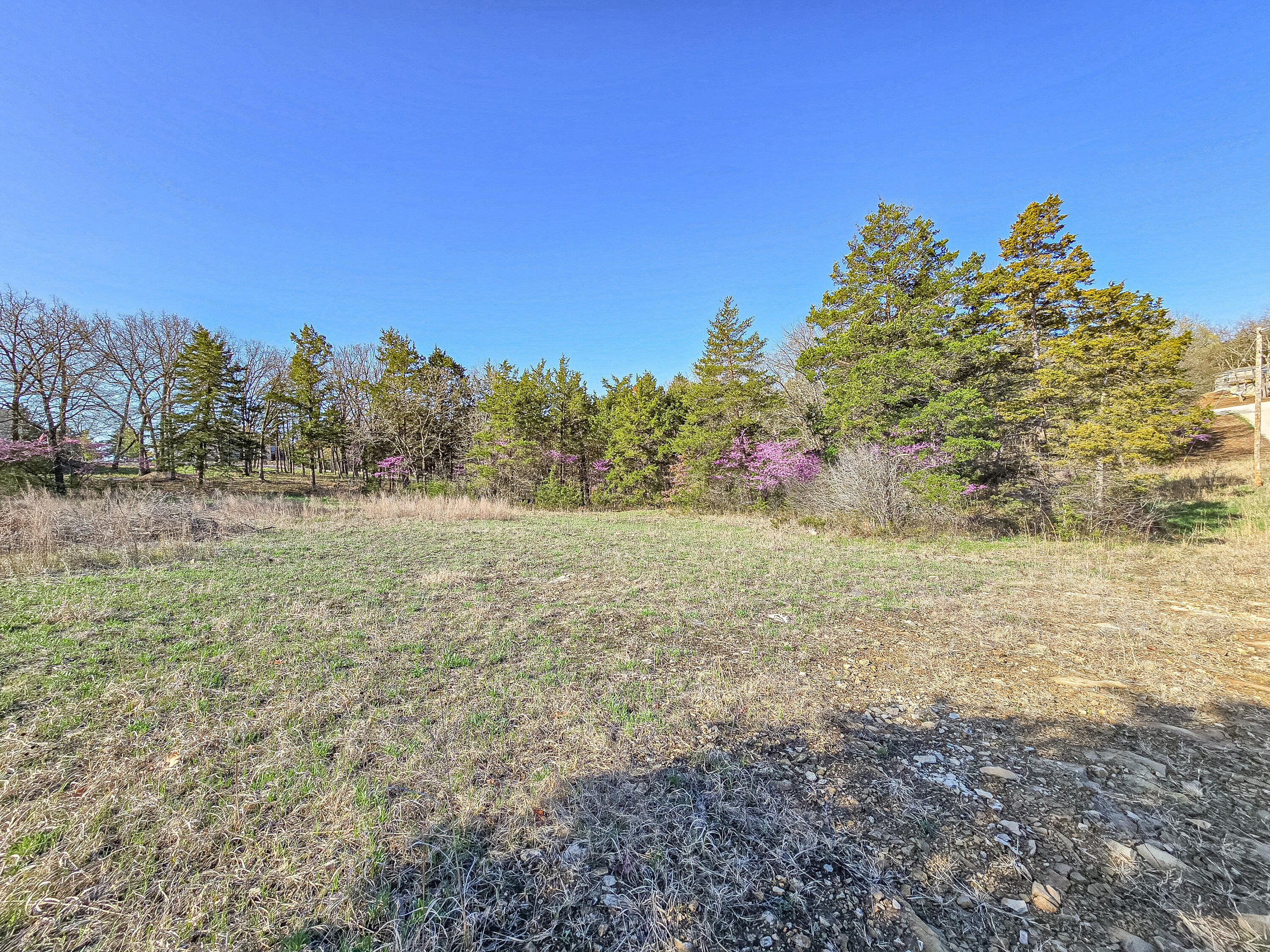 🚨 3 Acres - Prime Build Site Near the Lake - Water + Power On-Site 🚨Not your average lot.This 3-acre gem sits on gently rolling ground in a fantastic location--paved road access, rural water, and 50-amp electric. It's ready for your lake getaway or full-time home.NO gravel. Just smooth sailing all the way in.Minutes to the boat ramp, swim beach, and gas station--everything you need for lake living without the crowd.Restrictions apply to protect your investment--so no junk, no chaos--just a solid, clean area with real potential. Whether you're looking to build now or hold onto a great piece of ground, this one delivers.