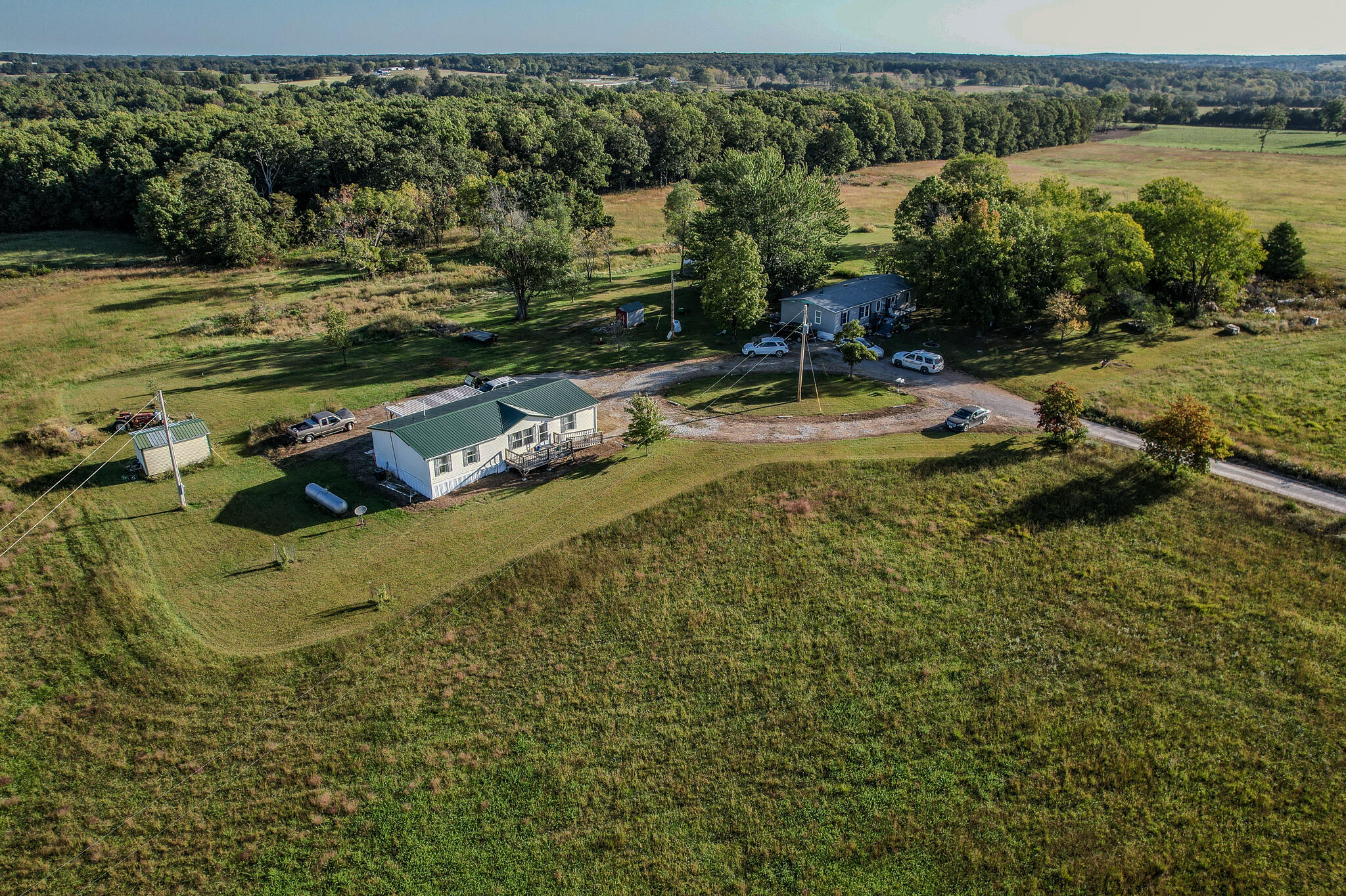 Located approximately 2.5 miles out of Conway. 69.99 acres consists of two adjoining properties. 80 percent is open, and approximately 20 acres are wooded. Beautiful gently rolling fields for your horses, cattle, or sheep. The 3 bedrooms, 2 bath manufactured home is located at the end of a dead-end road for maximum privacy. Property has 2 ponds. With additional entrance on Handley Road in case the buyer would like to build another home, or divide. Property has been partially surveyed.