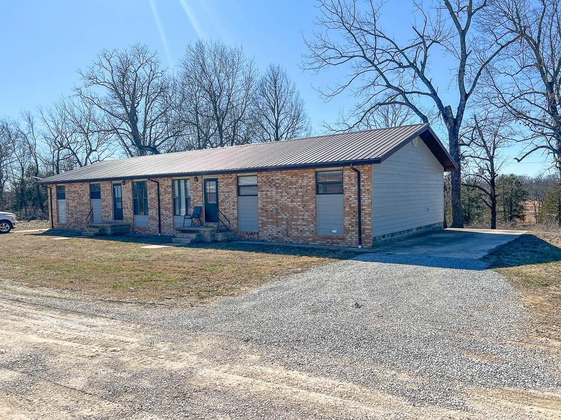 Prime Investment Opportunity near Bull Shoals Lake - 90 Storage Units, Duplex, and Room for Expansion! 90 Self-Service Storage Units: These fully operational storage units come with high-tech security cameras that provide 24/7 surveillance, ensuring peace of mind for both tenants and owners. Duplex with Airbnb Potential: The property features a well-maintained duplex, with each side offering 3 bedrooms, 1 bathroom, and an open-concept floor plan. Currently being used as a successful Airbnb rental, it generates steady income and is a great short-term or long-term rentals. RV Site with Full Hook-Ups: The property includes an RV site with full hook-ups, ideal for additional income or offering accommodation for visitors to the nearby lake. Expansive 6.97 acres of land: With nearly 7 acres of land, there is substantial room for further development, whether it's expanding the existing storage units, adding additional rental properties, or creating more recreational spaces. The property is just a few miles from Bull Shoals lake, offering residents and tourists easy access to boating, fishing and outdoor recreation. This is a unique opportunity to acquire a property with diverse income potential. Whether you are looking for a profitable, low-maintenance investment, or a property with room to grow, this listing is one that you won't want to miss.