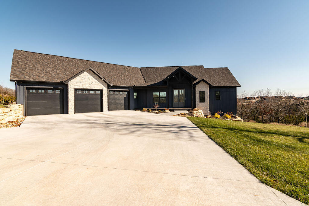 Are you looking for a new home, but don't want to wait 18 months to build one? You now have an opportunity to enjoy this custom-built home that together the owners and contractor thought of every detail and created a Masterpiece. The location at the top of the ridge with views for miles to the east from the back of home.  The floorplan is perfect for those wanting ease of single level living, with lower level designed for others or hobbies. Upon entry at the Foyer, you will stop and be amazed at the style and views. The Great Room has a wall of glass doors to screened Deck. Electric fireplace with tv mounted above.  The Kitchen design with workspace, island, both food and appliance pantries, stainless steel appliances and more will be the chef's delight. Dining area has direct access to the BBQ Deck and a third deck., From the Kitchen, there is nice sized Laundry Room, Half Bath and Mudroom before entering the Garage. The oversized 30 x 36 Garage has separate electrical circuits, mini split unit to control temperature and you'll love the finished floor and high door height.Master Suite is off the Great Room with dual vanities with LED Mirrors, 5x5 walkin shower, 2 closets and more! And then we go to lower level. Family Room, 2 bedrooms, 2 full baths- one with tub and the other with walkin shower. Storage Room, Bonus Room (finished but no flooring), storm room and access to large patio. Also the photos of exercise room with rollup garage room is wired for a hottub and a floor drain. The front winows of the home has been tinted for privacy. The Landscaping is designed for minimal care and the rock design was planned to add beauty to functionality. The lot goes deep into the treed valley.Once again, the location is great within StoneBridge Village, a master planned golf community with lots of amenities and social activities. Monthly dues are $165.00 month, with golf rates for annual unlimited for single or family or pay as you play for 9 or 18 holes and cart.