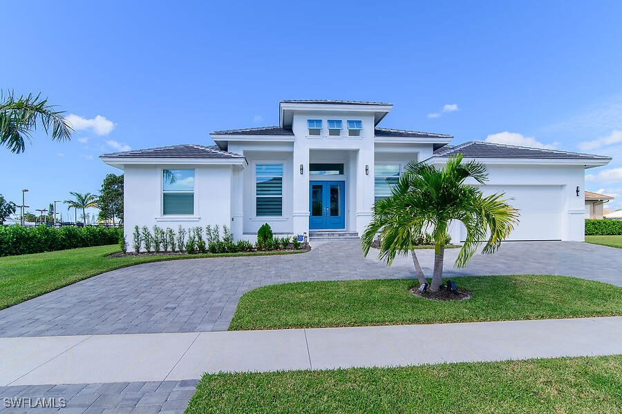 Single story house featuring french doors, a front