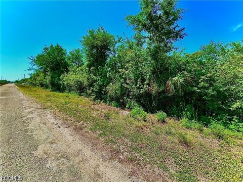 Photo of 857 Casper Yost Street E, Lehigh Acres, FL 33974 (MLS # 2026020044)