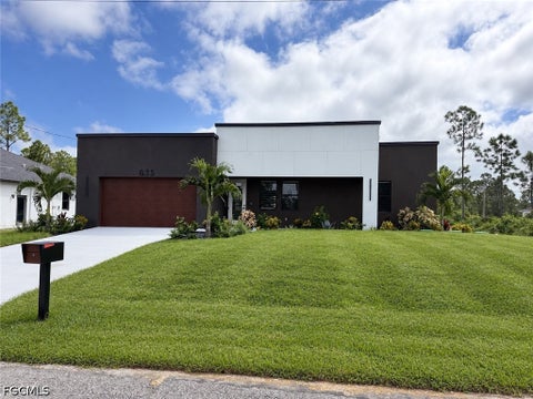 Photo of 835 Harnes Avenue S, Lehigh Acres, FL 33974 (MLS # 2026033155)