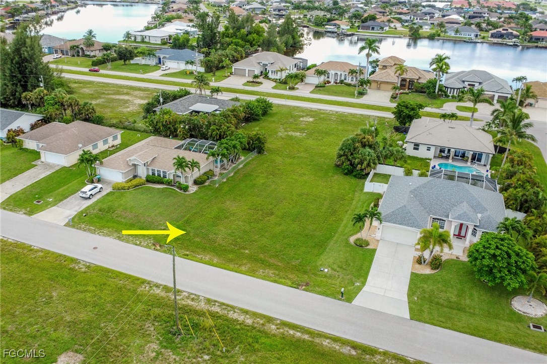 Aerial perspective of suburban area with a nearby