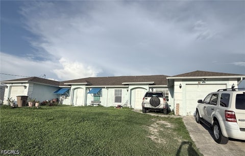 Photo of 1109-1111 Gilbert Avenue S, Lehigh Acres, FL 33973 (MLS # 2026039651)